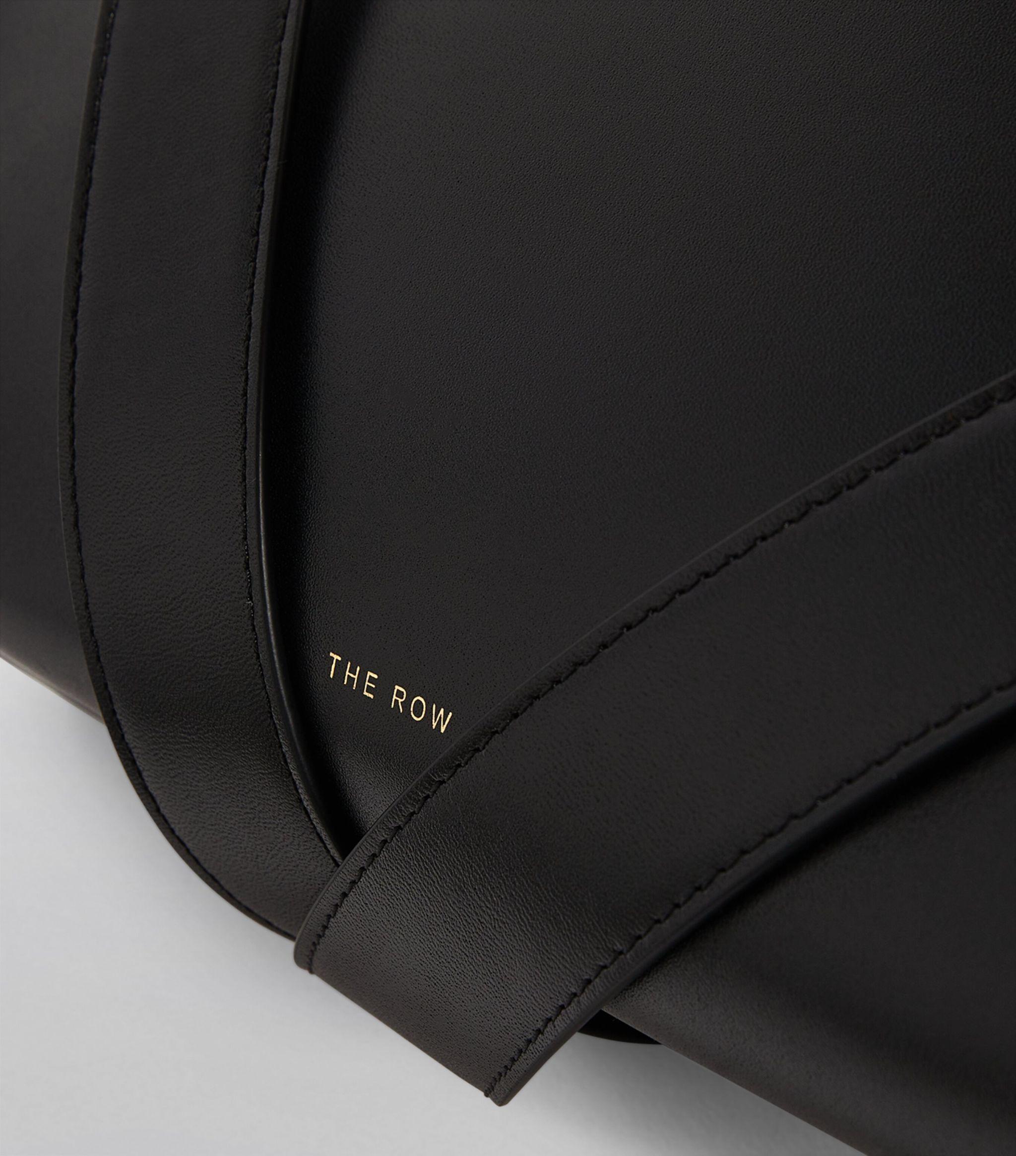 The Row Leather Isla Clutch Bag in Black | Lyst
