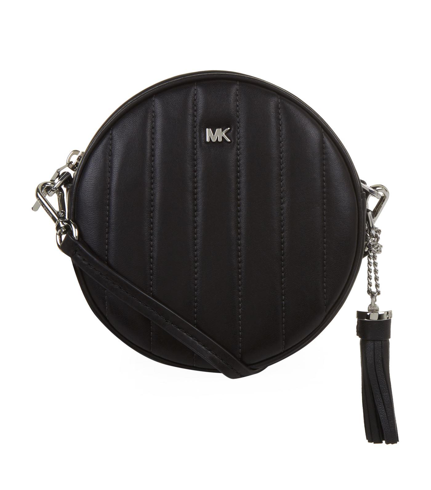 Michael Quilted Round Cross Body Bag in Black - Lyst
