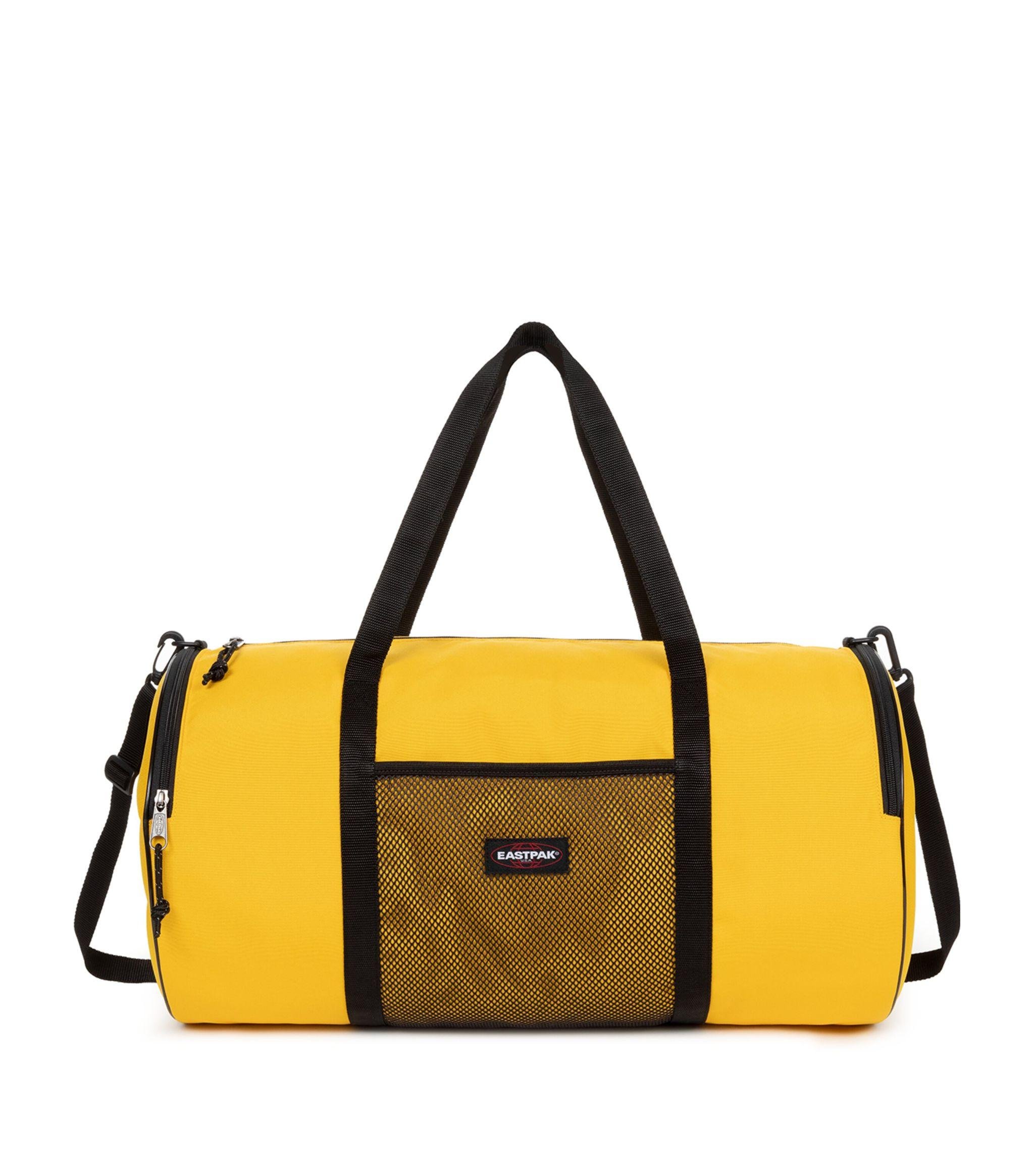 Eastpak X Telfar Large Duffle Bag in Yellow | Lyst