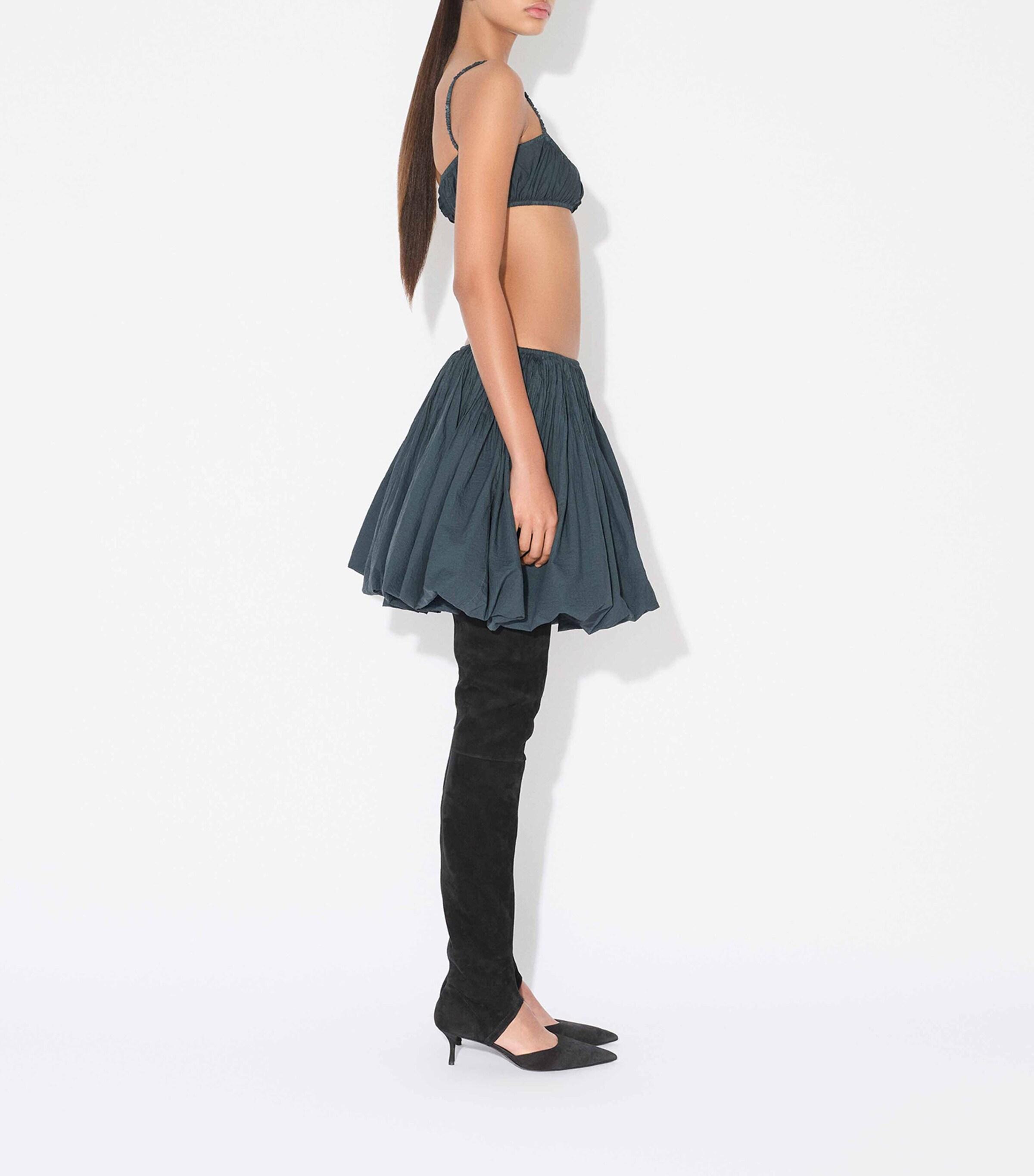 ミニスカート ALAIA SKATER MINI SKIRT ALAÏA Skater Skirt in Bleu Fonce | FWRD