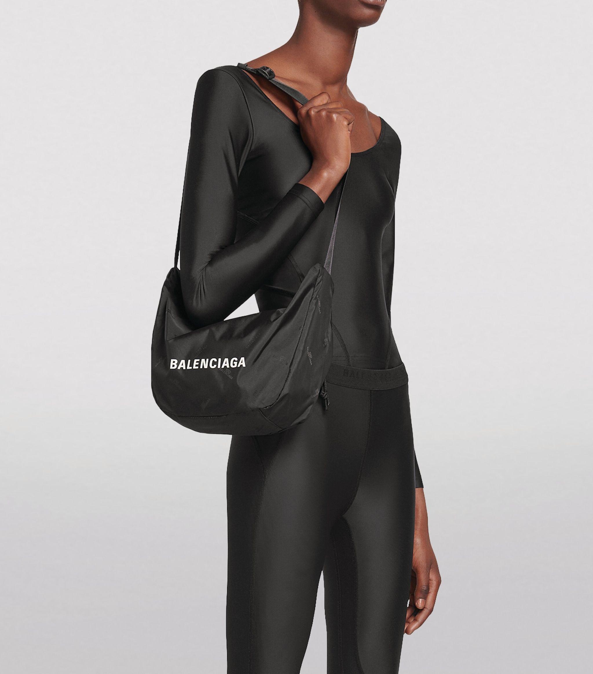 Balenciaga Synthetic Wheel Sling Bag in Black | Lyst