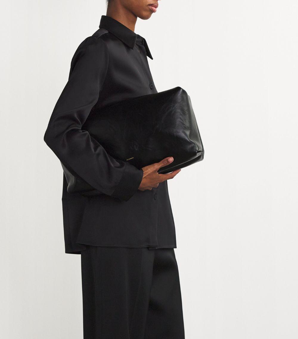 【関税&送料込】Jil Sander Black Leather Cushion Crossbody B Cushion Small Woman | Jil Sander Official Online Store