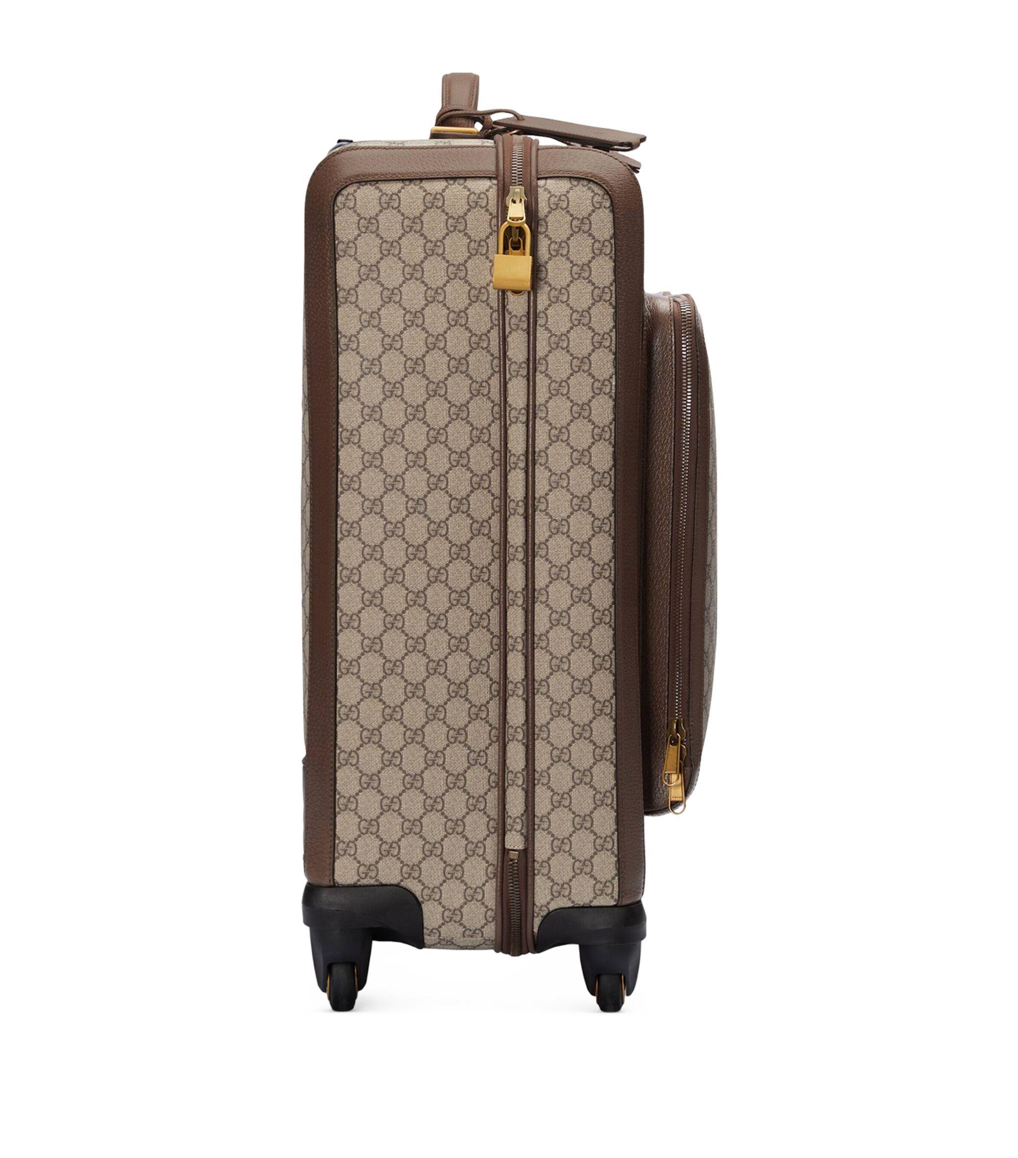 Gucci luggage sale hotsell