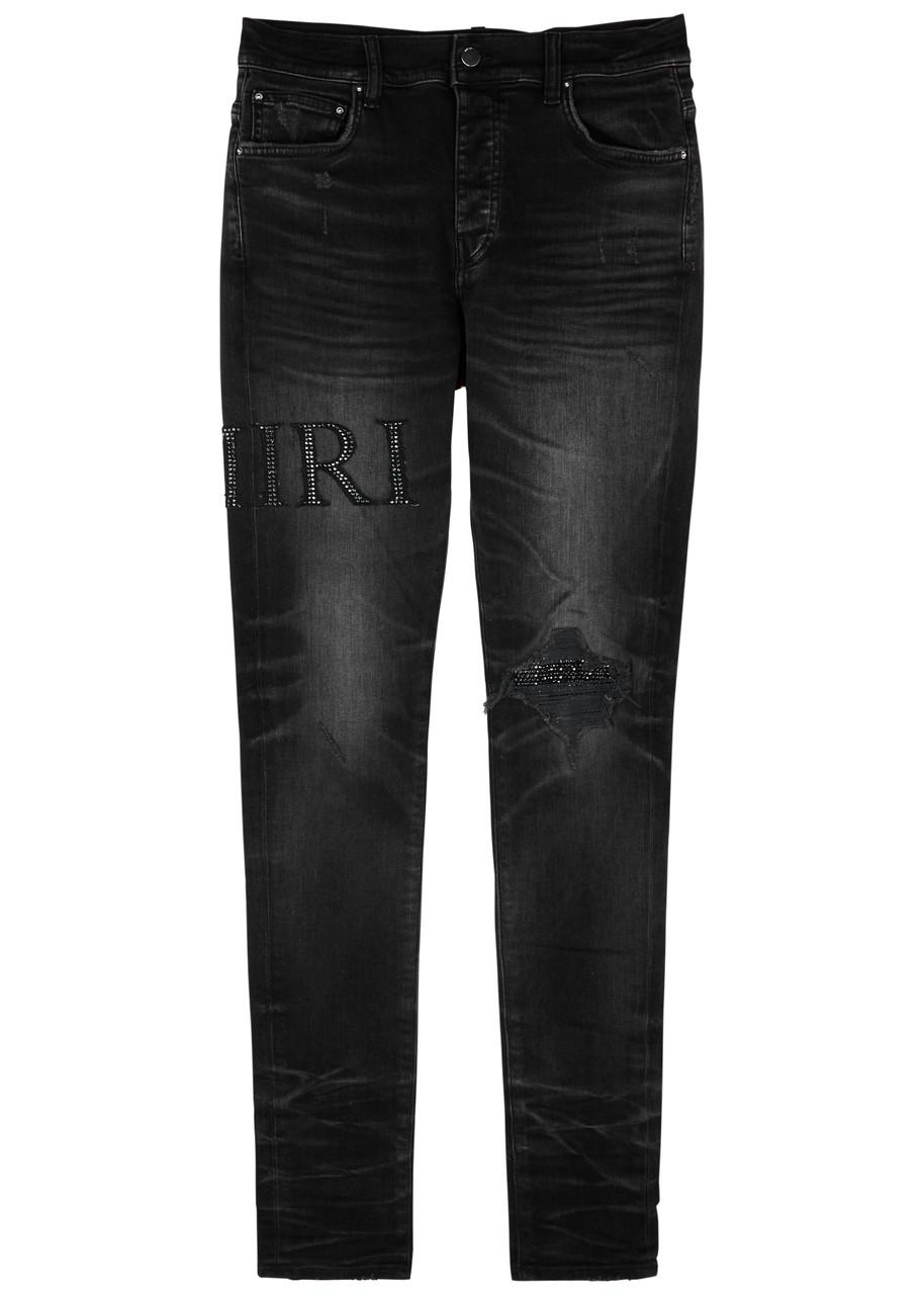 Amiri Logo-embellished Distressed Skinny Jeans in Black for