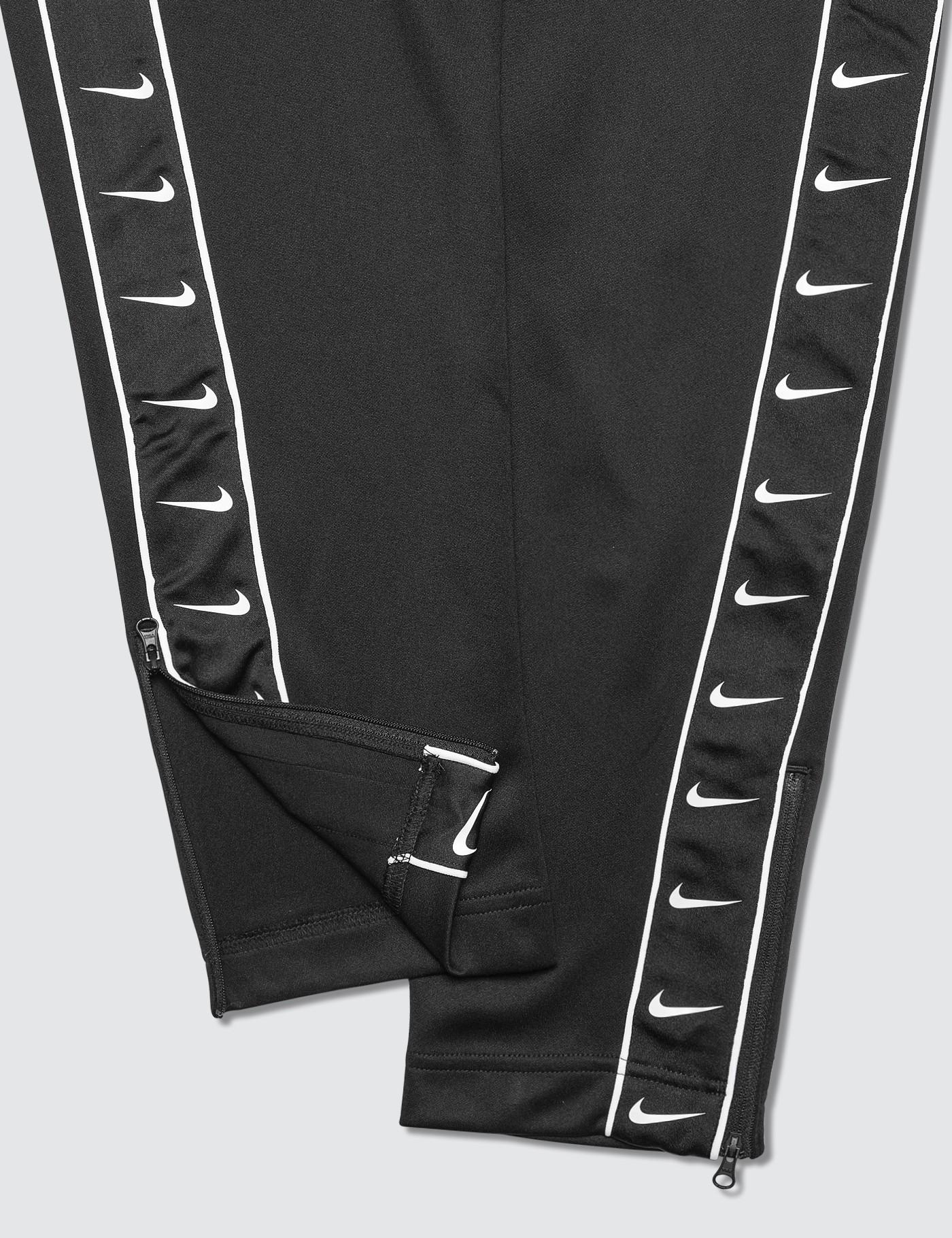 nike side swoosh logo track pants