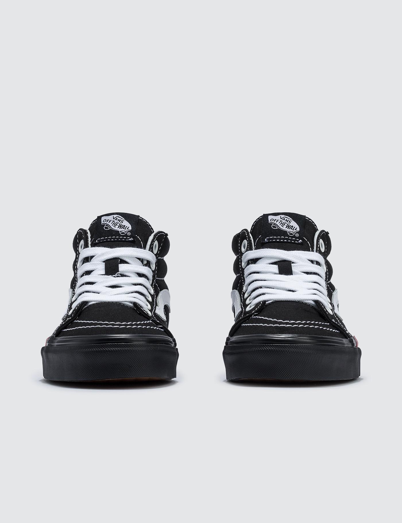 vans mid top dorados