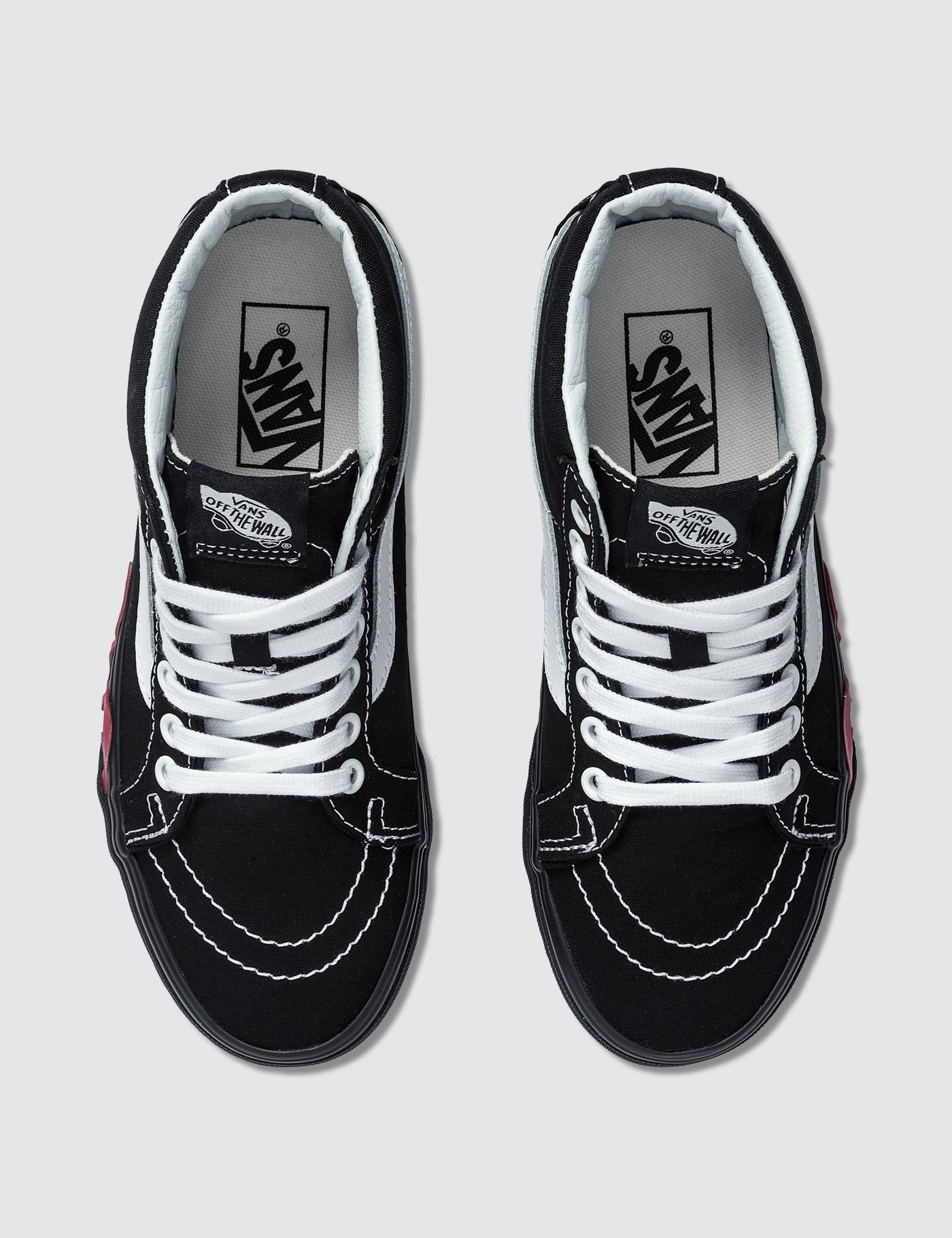 vans mid top dorados