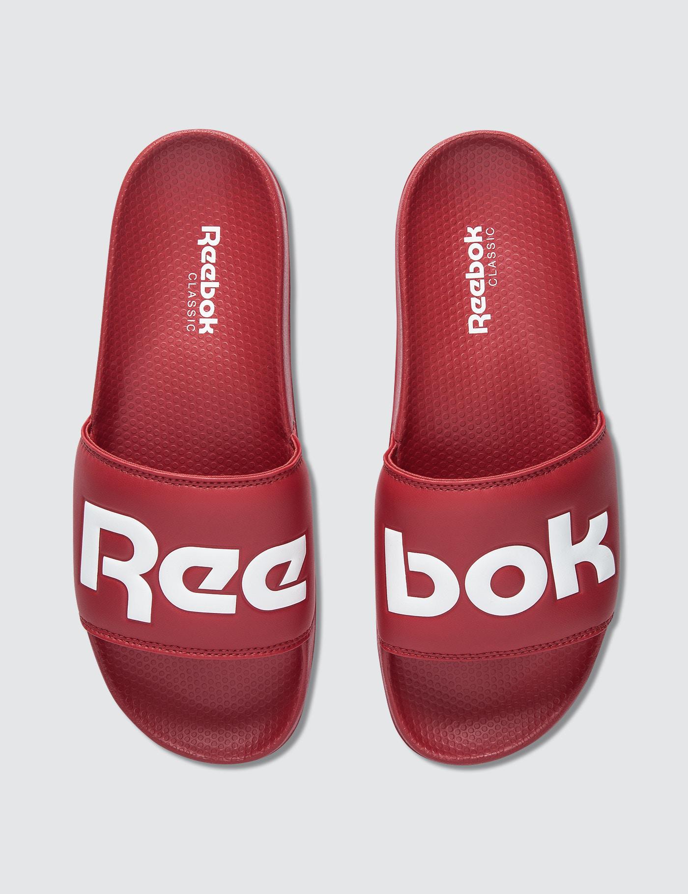 red reebok slides