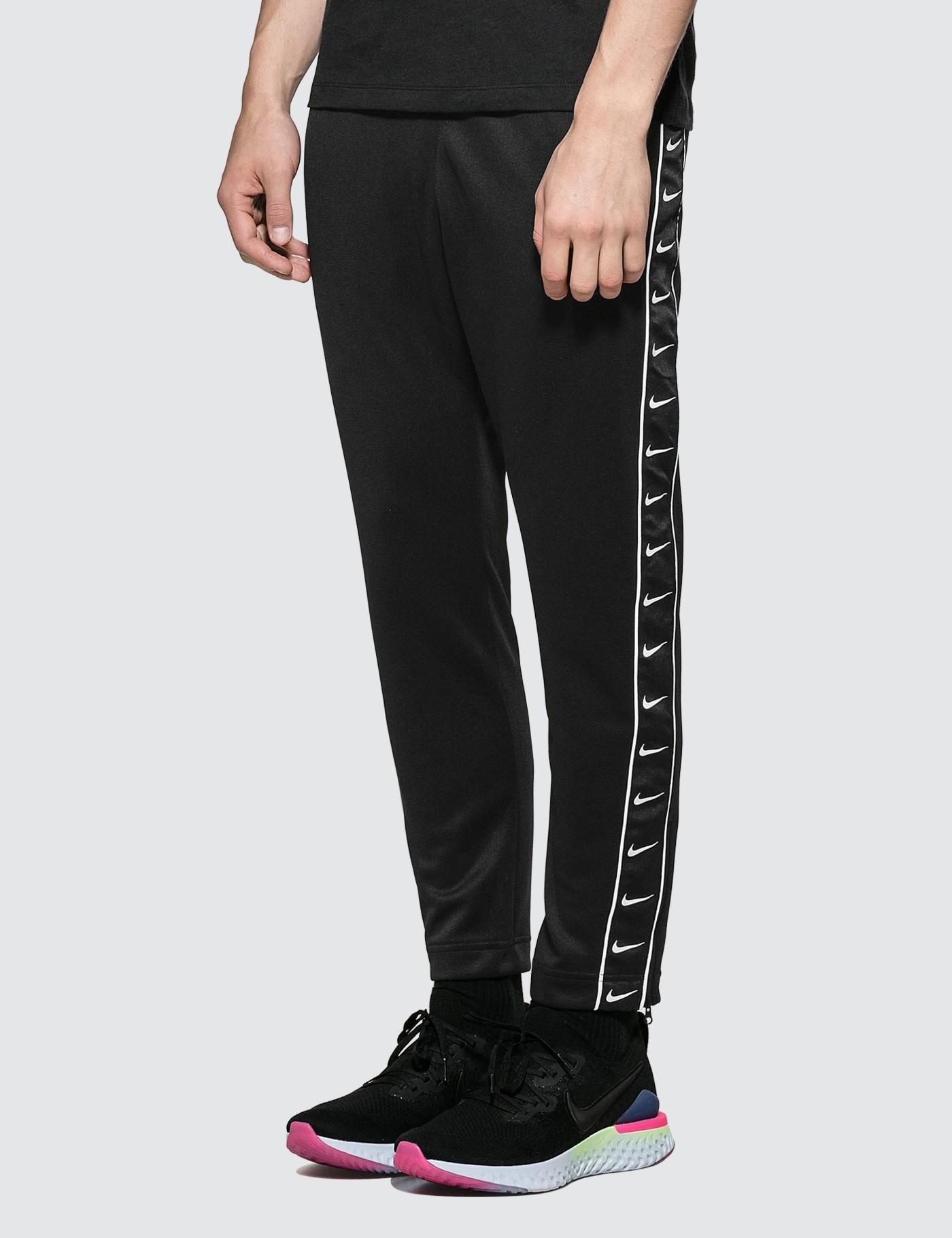 Nike Synthetic Side Swoosh Logo Track Pants in Black for Men | Lyst
