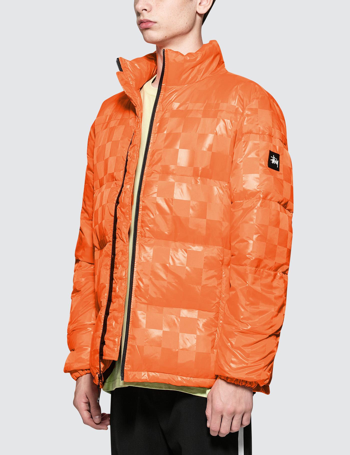 long orange puffer jacket