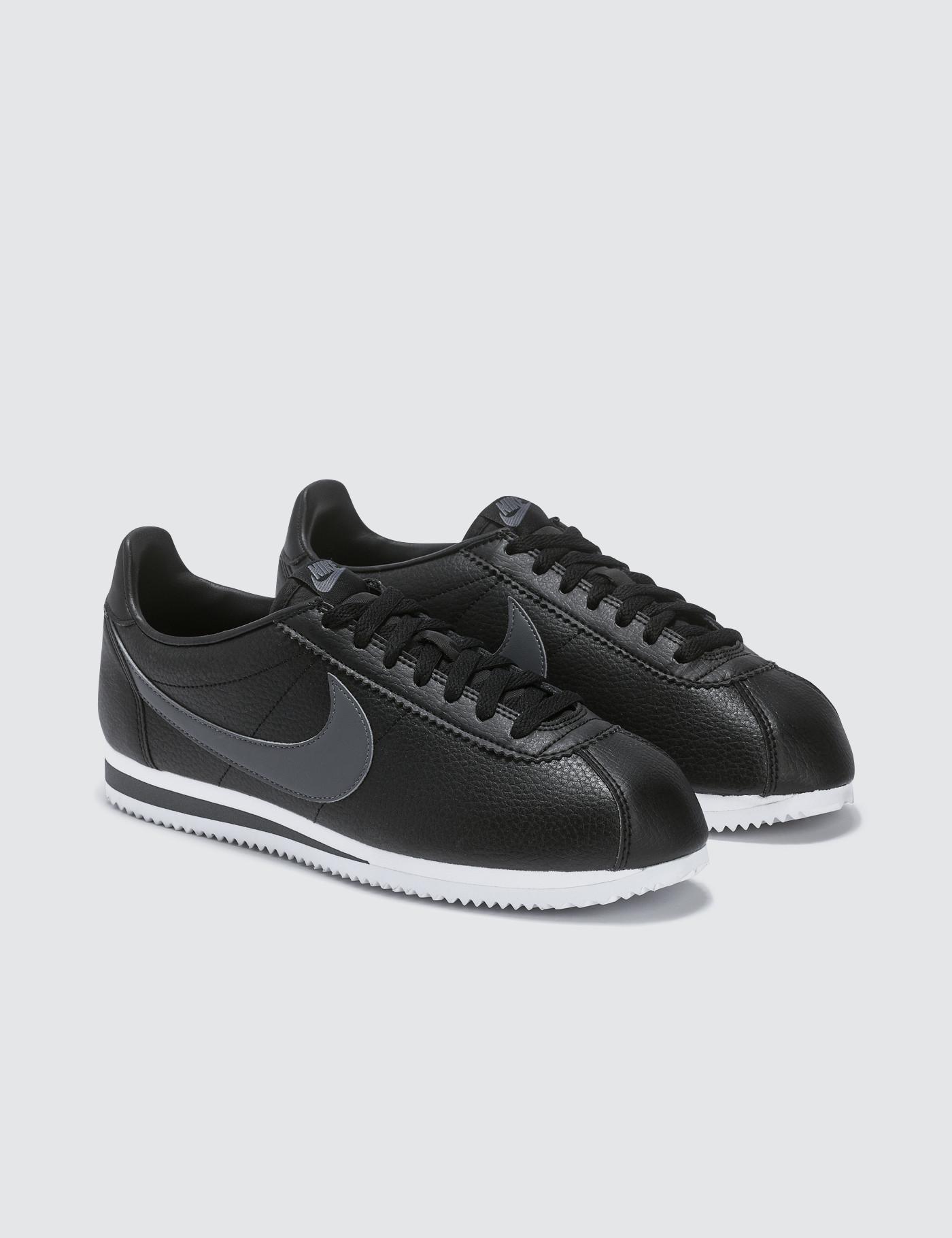 black and gray nike cortez