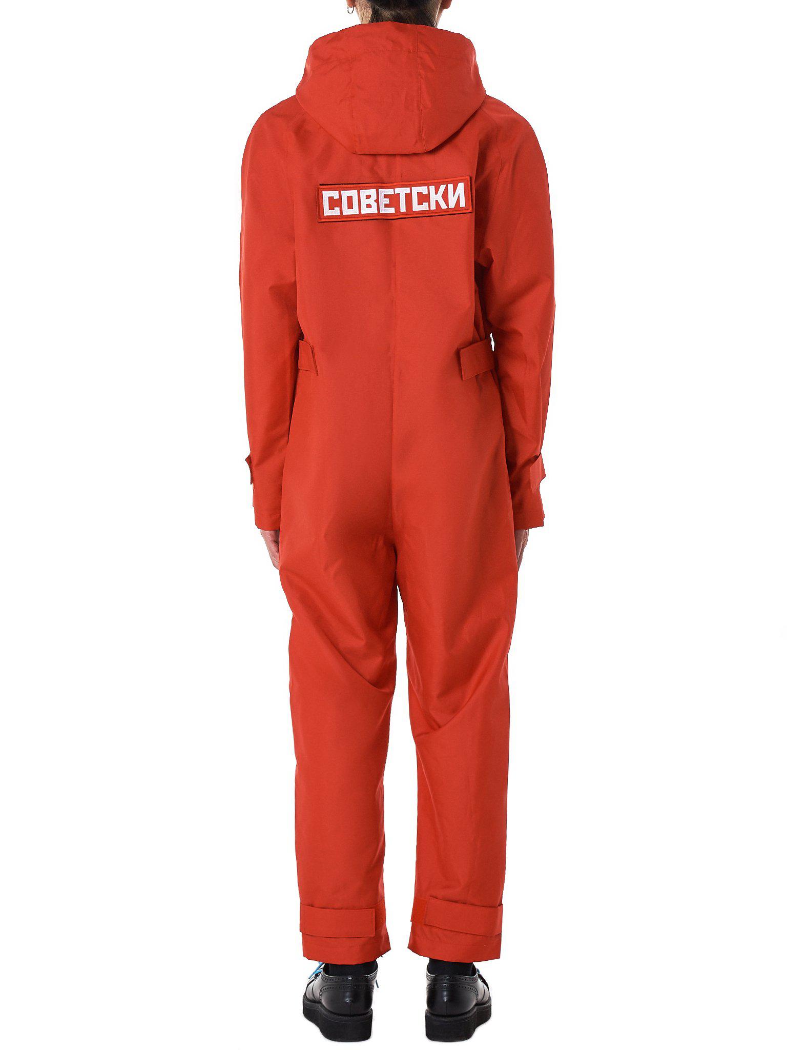 red hooded jumpsuit