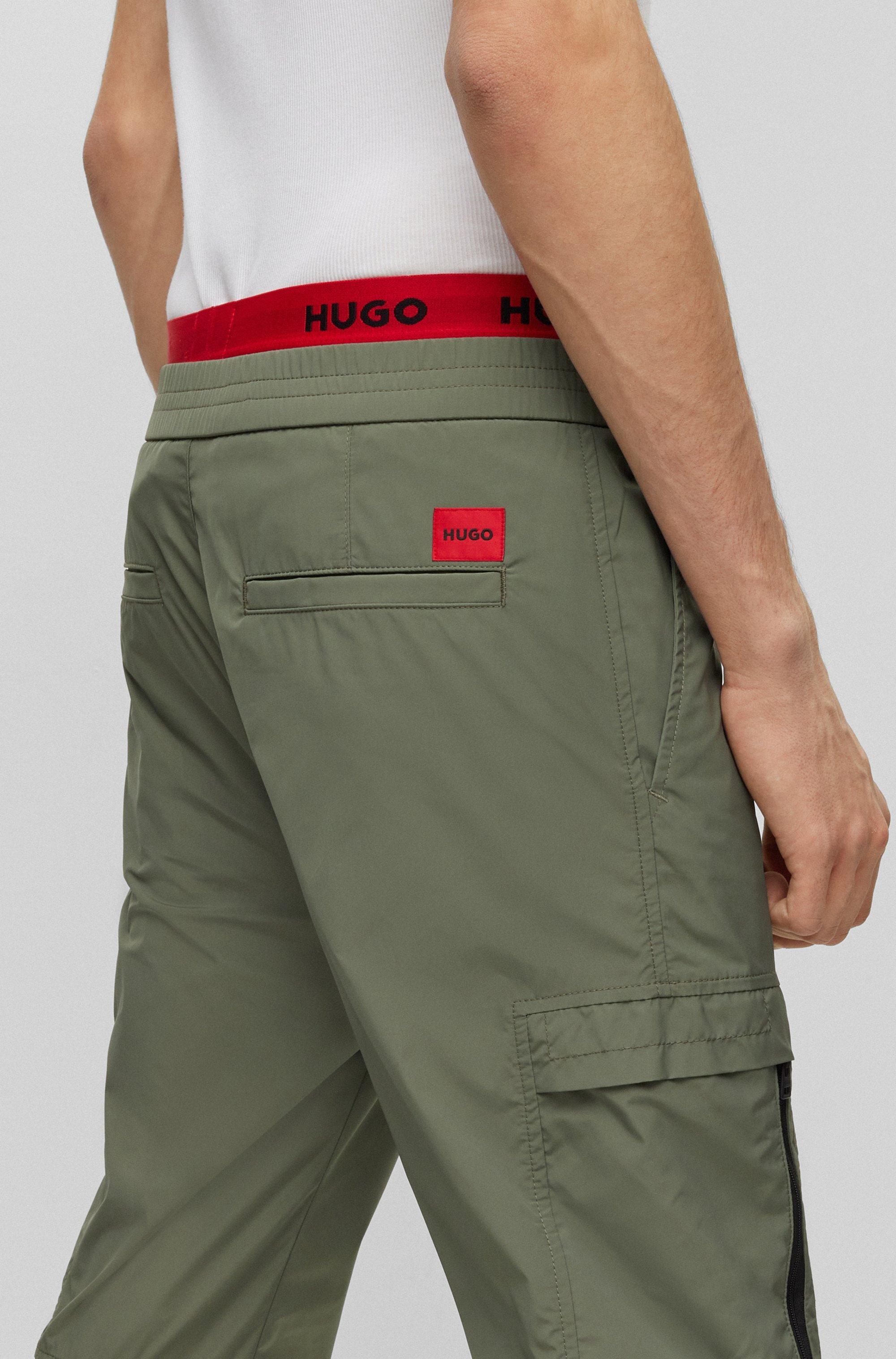 BOSS by HUGO BOSS Slim-fit Cuffed Trousers With Red Logo Label in Green for  Men | Lyst