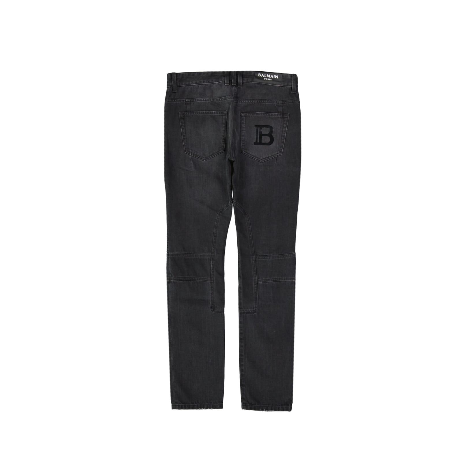 BALMAIN - SLIM FIT COTTON JEANS WITH TEARS AND SYNTHETIC LEATHER PANELS -  Eleonora Bonucci