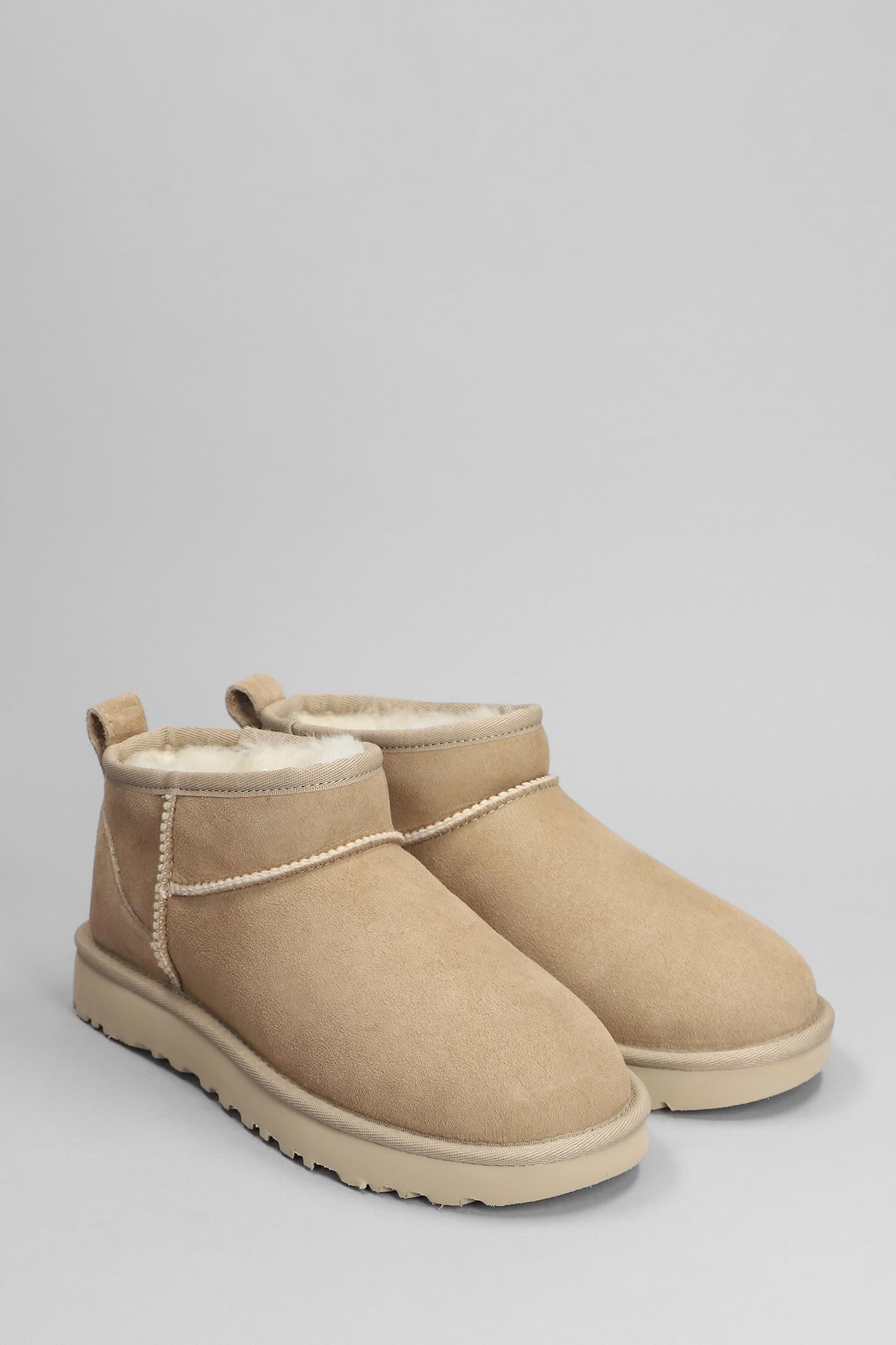 UGG Classic Ultra Mini Sheepskin Ankle Boots in Natural | Lyst