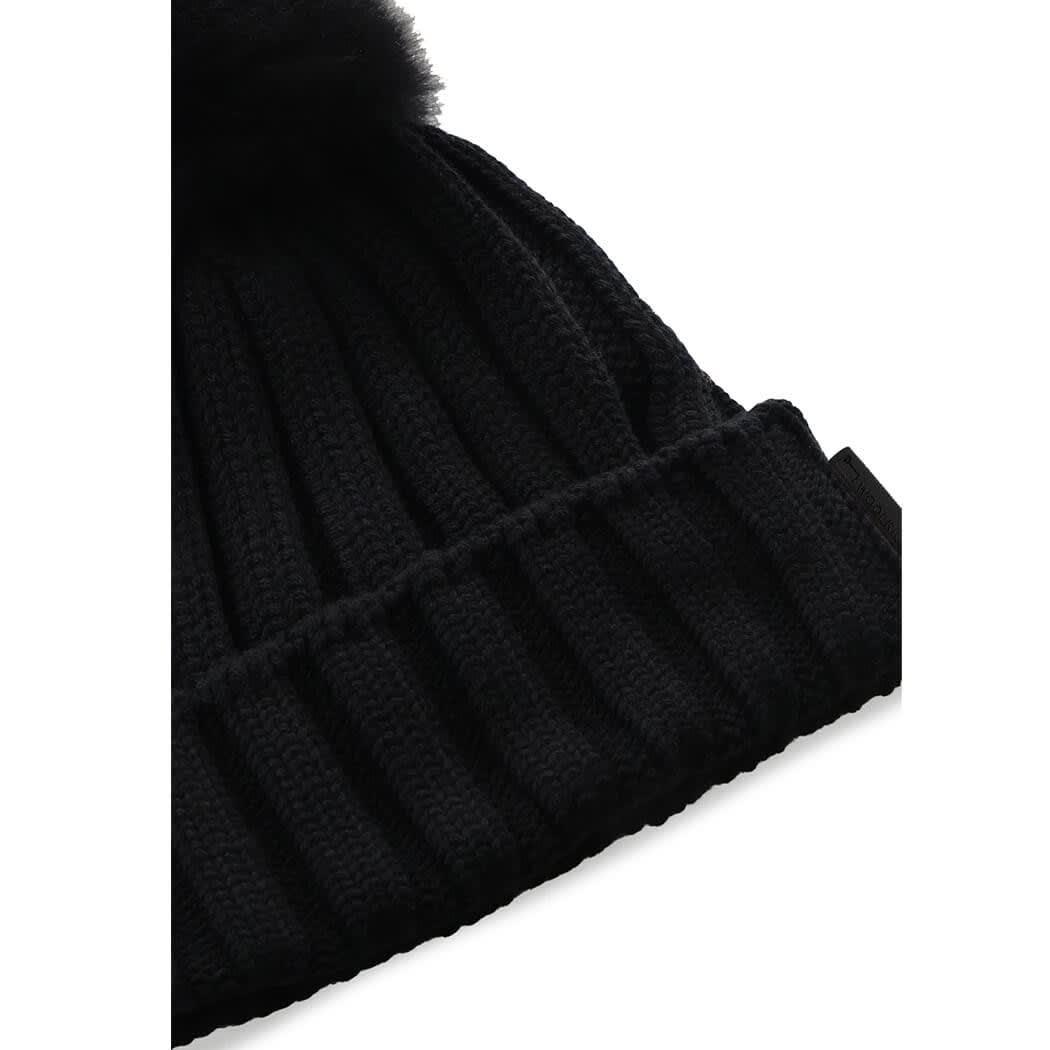 black beanie with ball on top