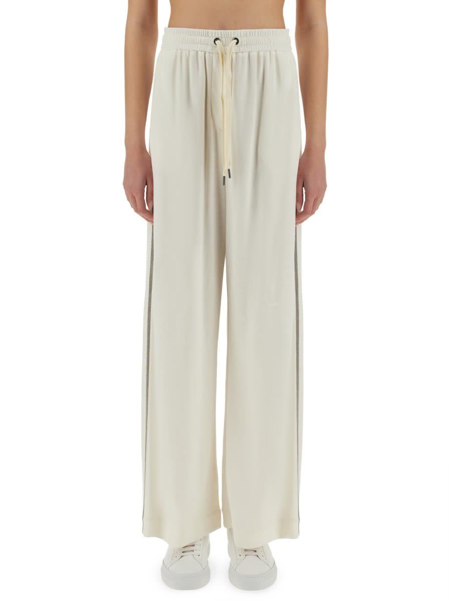 パンツ BRUNELLO CUCINELLI TRACK PANTS WITH NECKLACE Brunello Cucinelli Track Pants With Necklace in Natural | Lyst