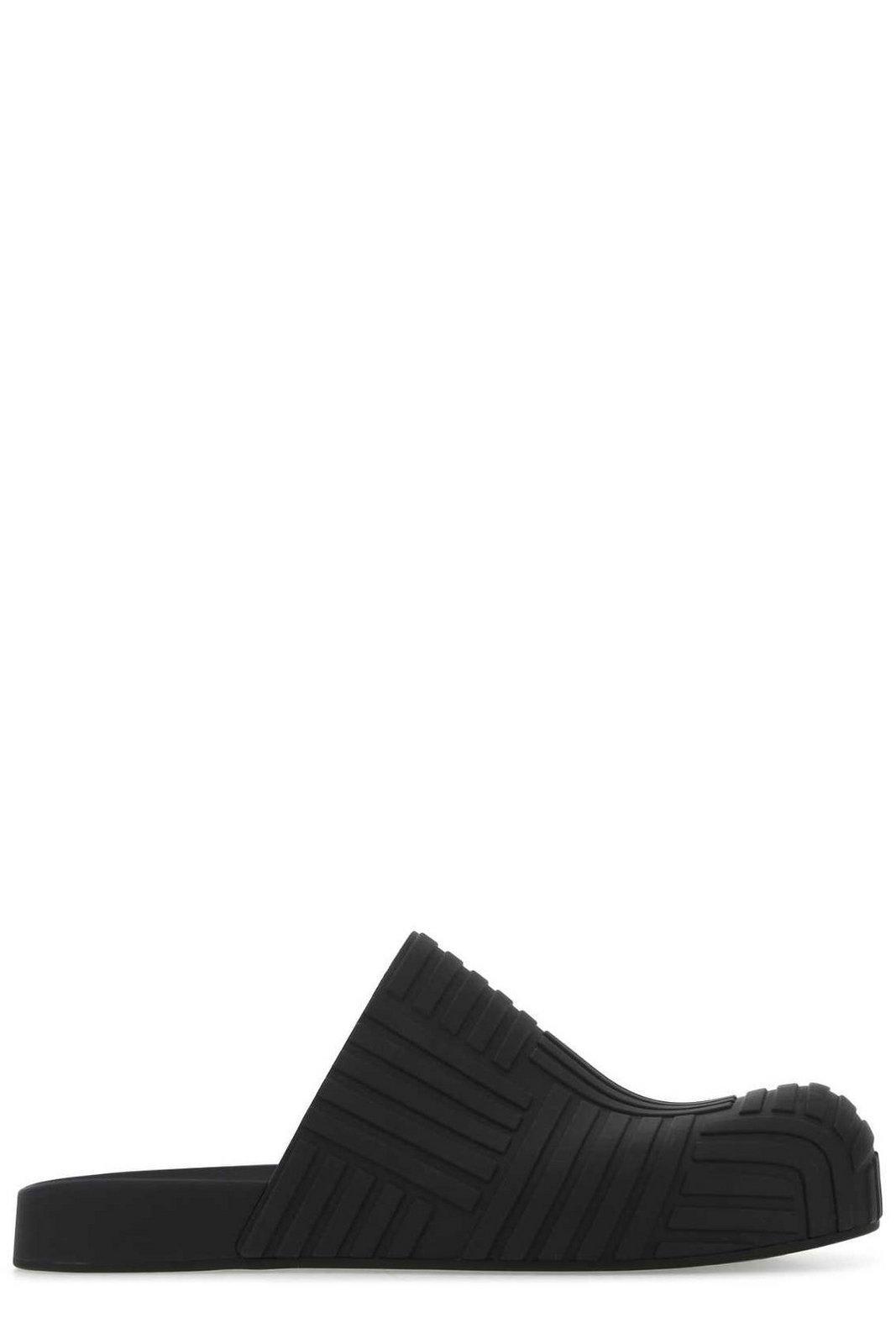 Bottega Veneta Embossed Rubber Clogs in Black for Men Mens Shoes Slip-on shoes Slippers 