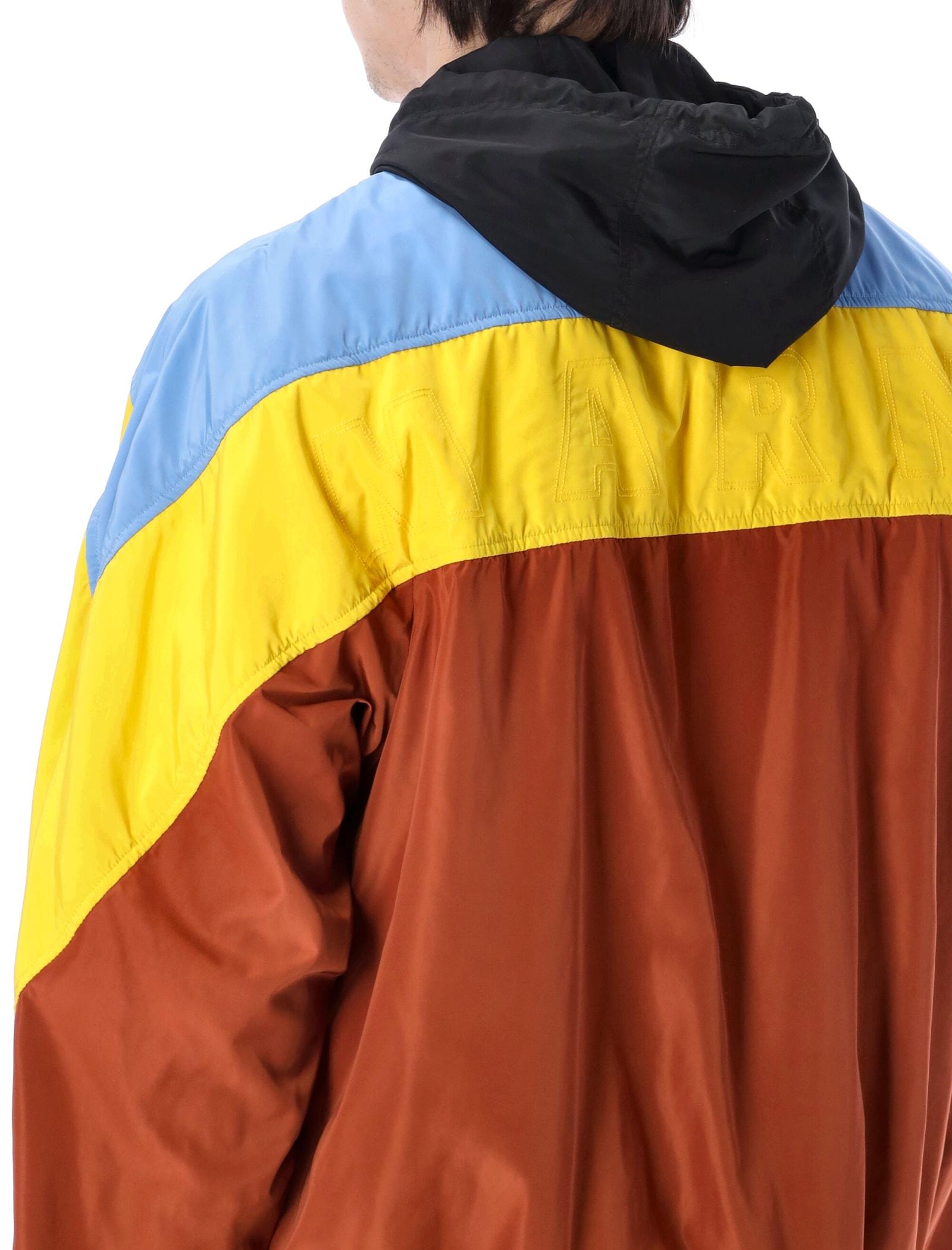 red and yellow windbreaker