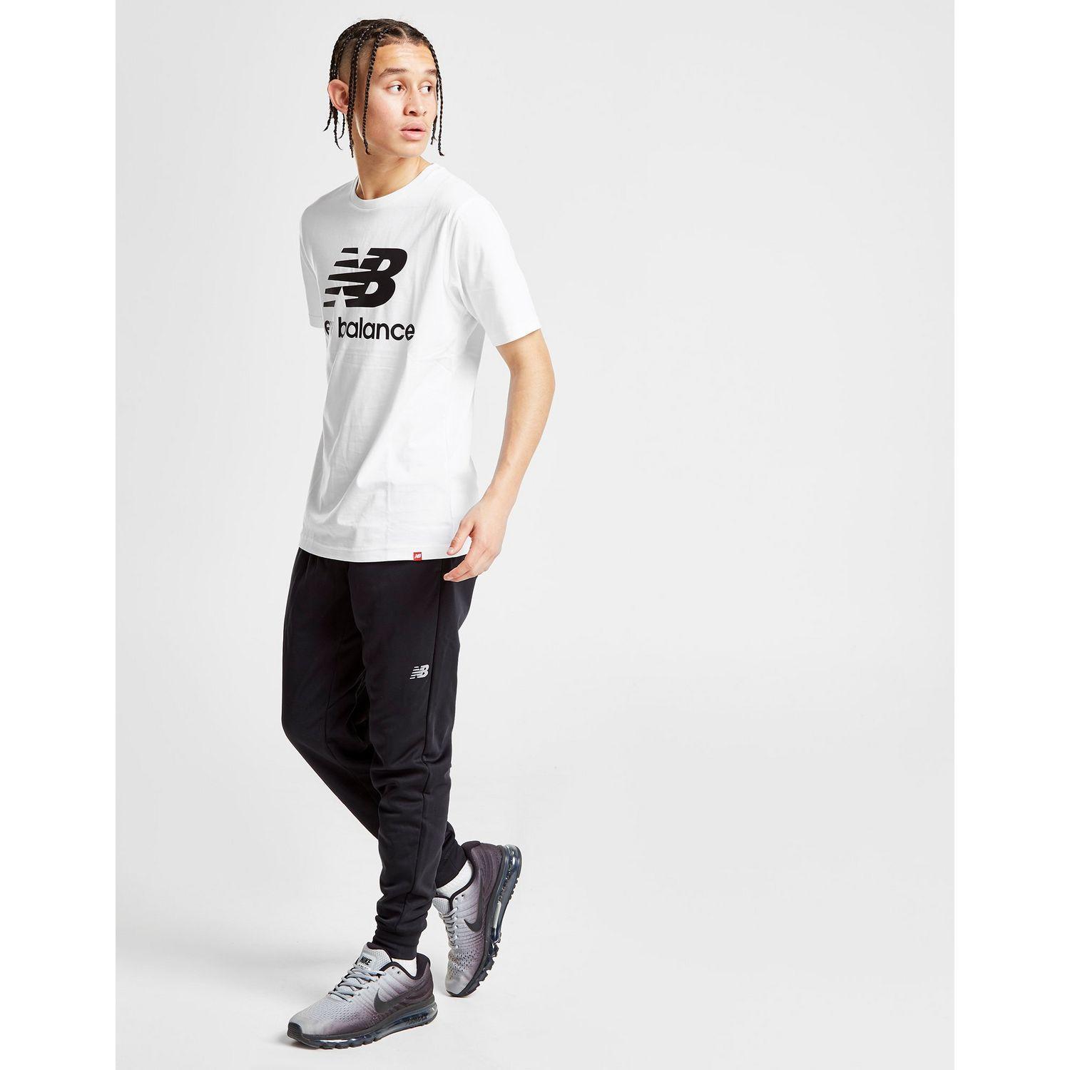 New Balance Synthetic Poly Track Pants in Black for Men - Lyst