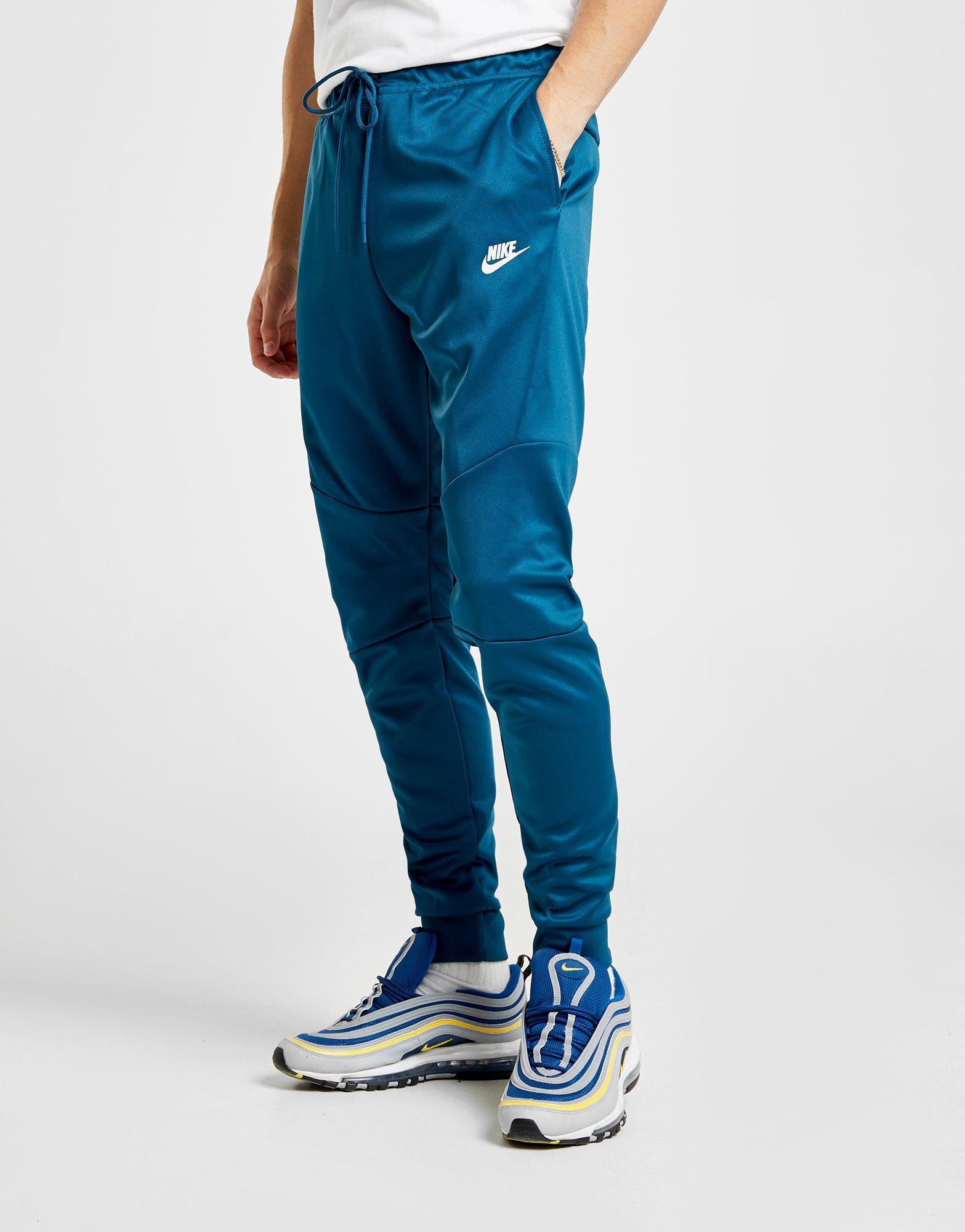 turquoise nike joggers