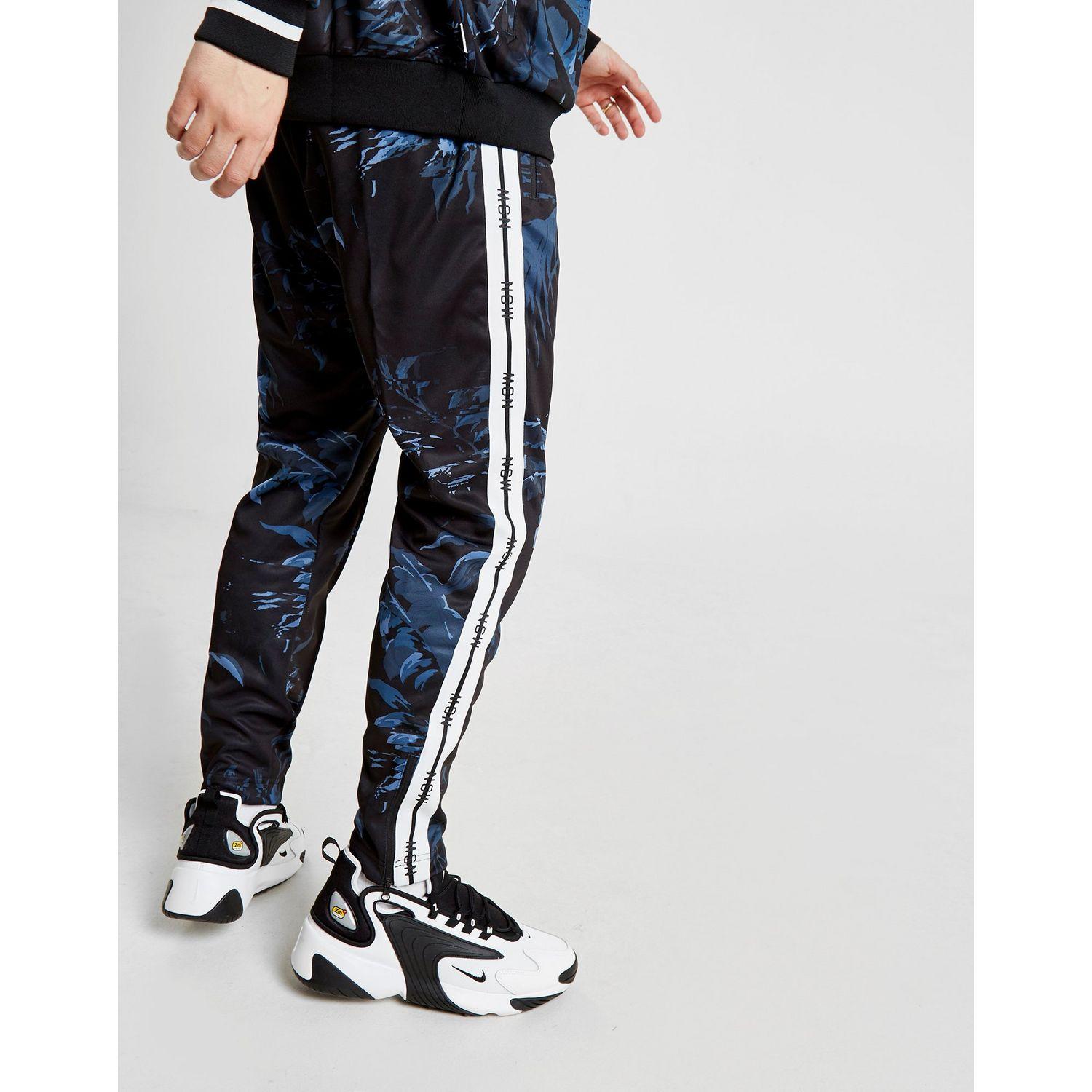 nike sportswear all over print track pants