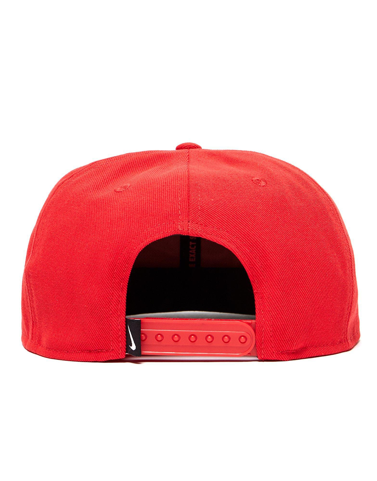 red and white nike cap