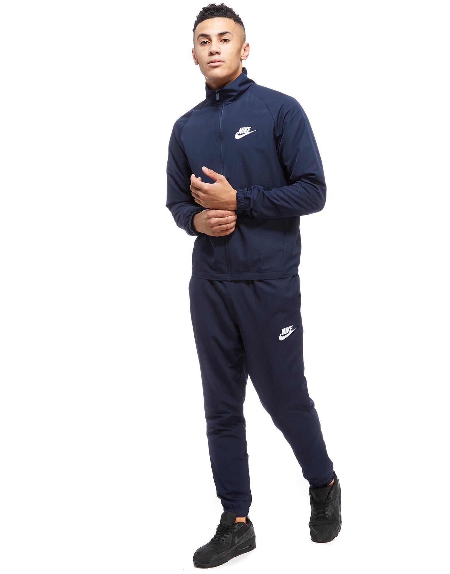 nike woven tracksuit blue