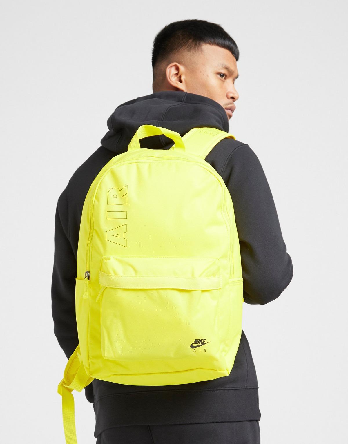 black and yellow nike backpack