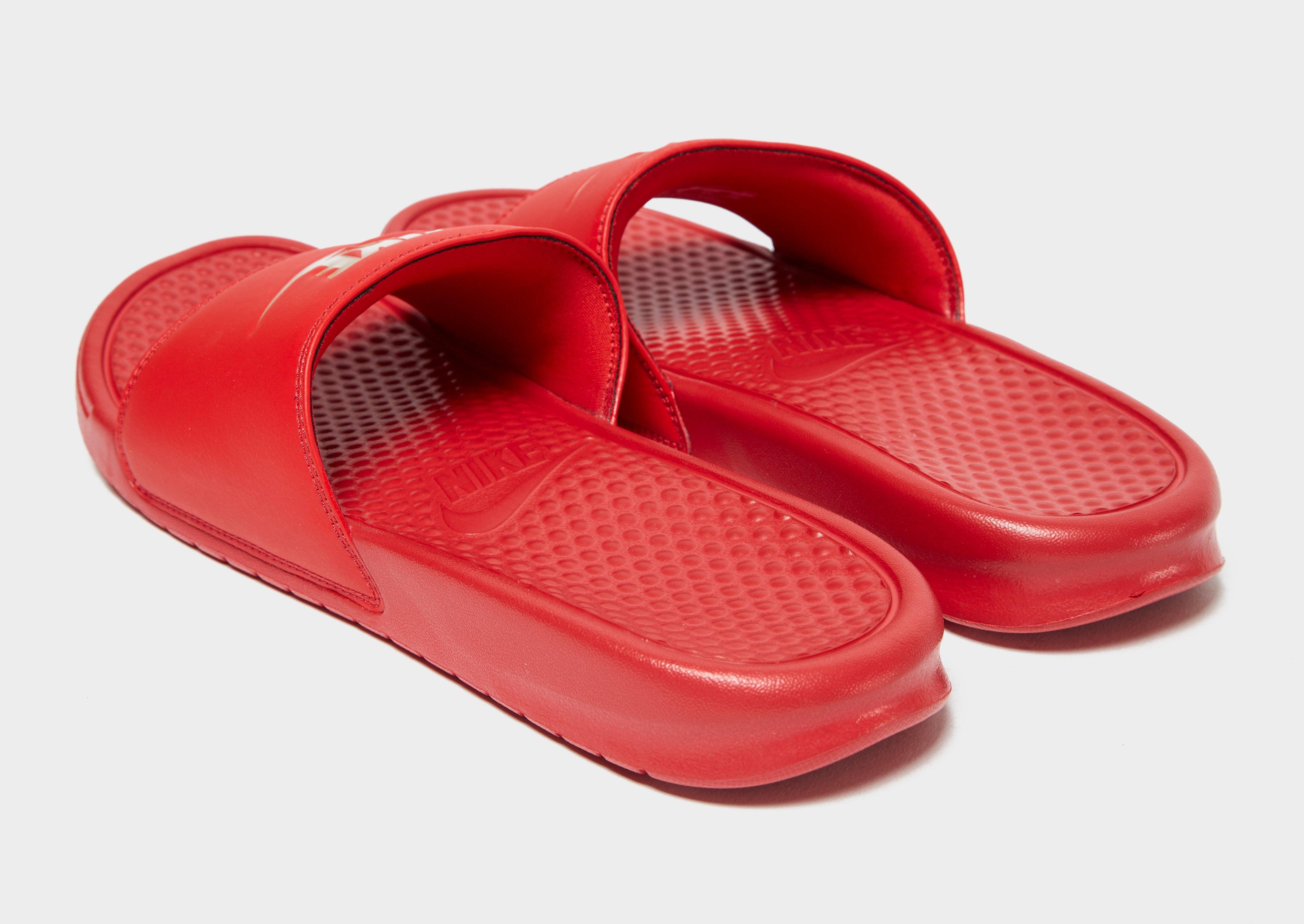 red gold nike flip flops