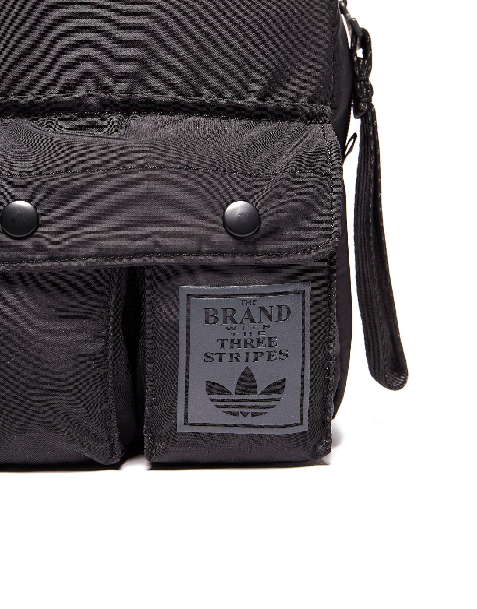 the brand with the three stripes bag