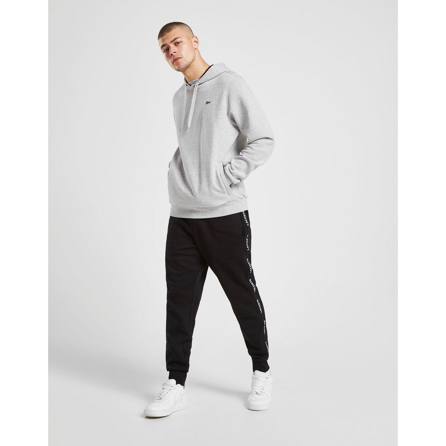 lacoste tape woven track pants