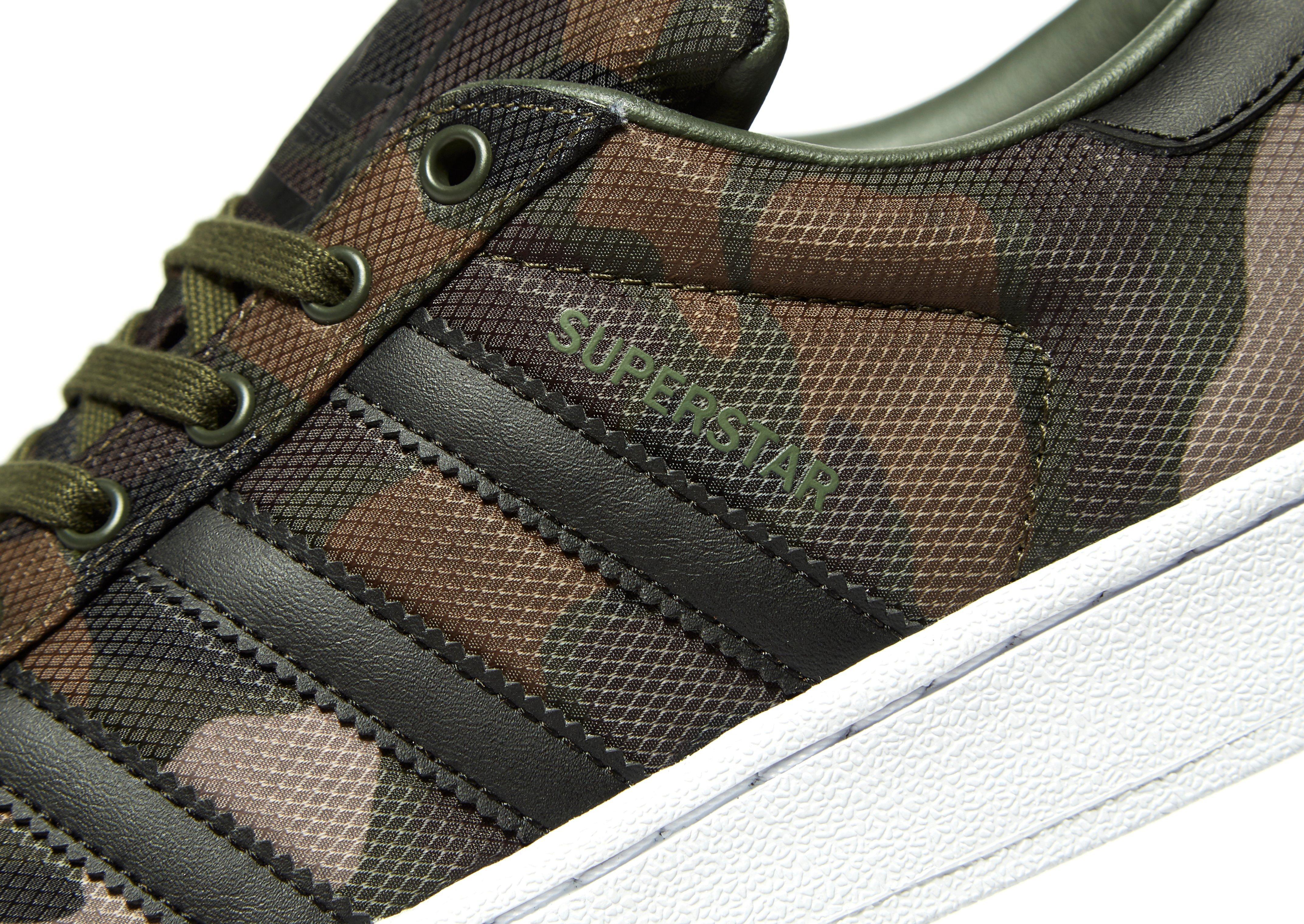 green camo trainers