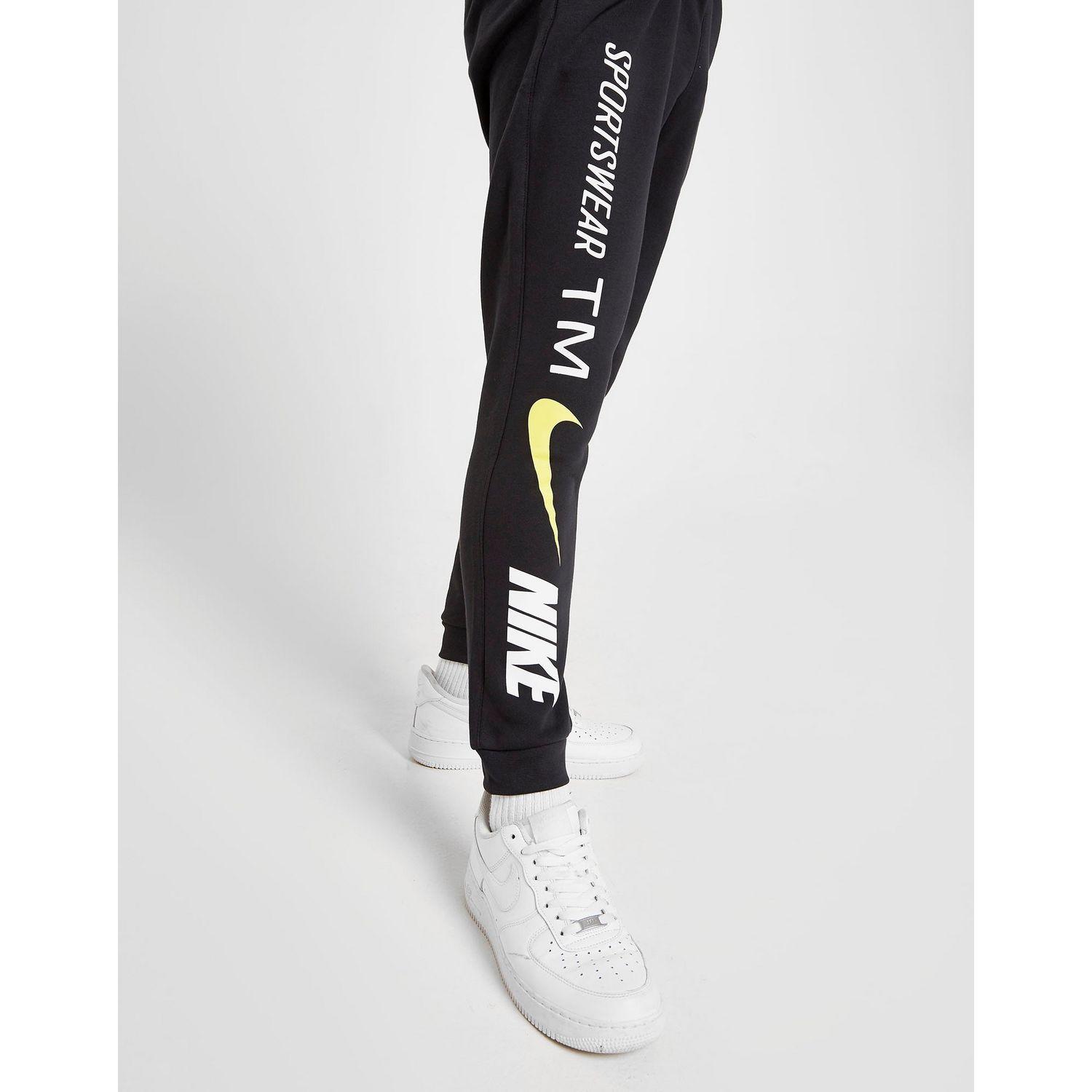 nike tracksuit black and yellow