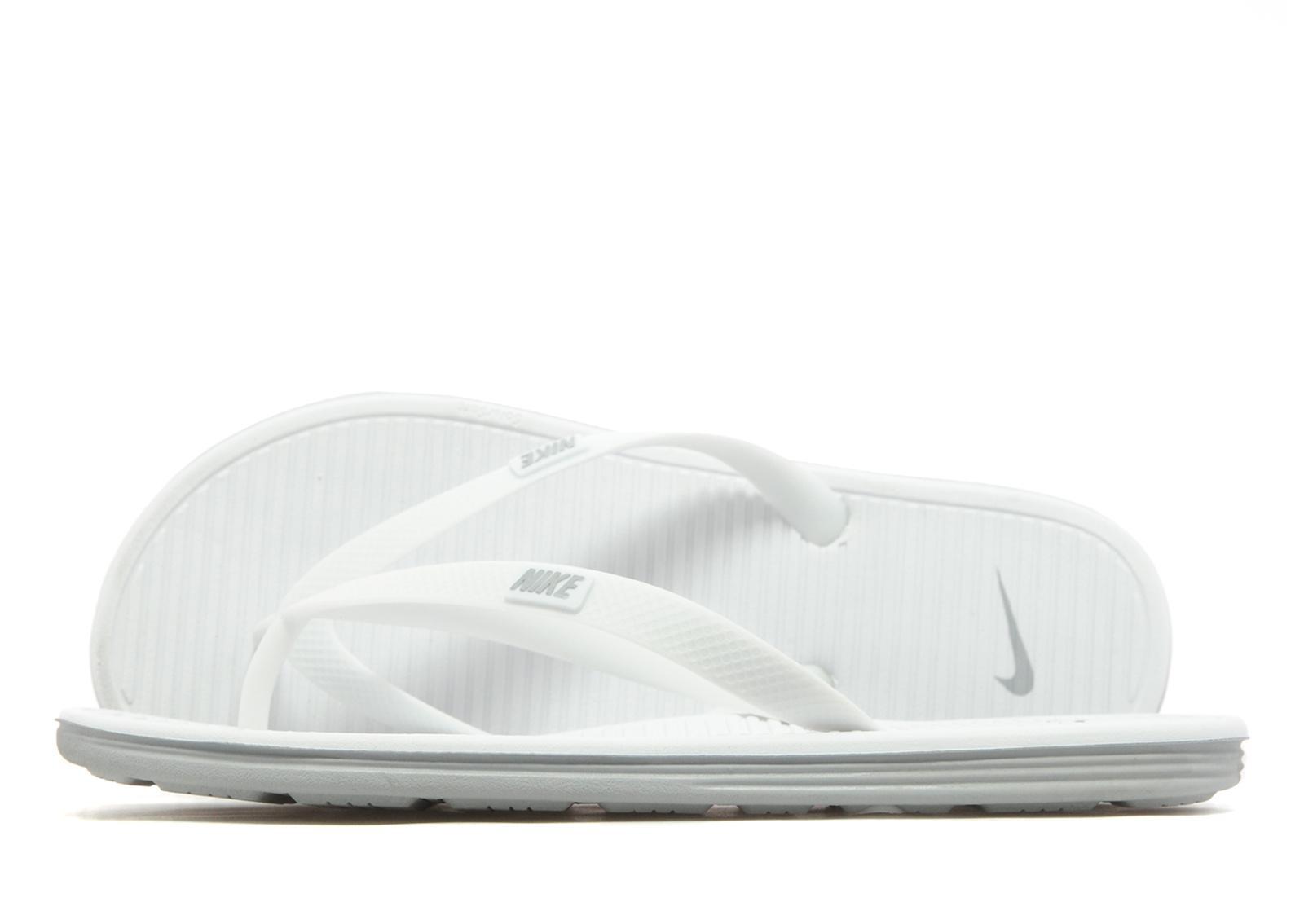 nike solarsoft flip flops white