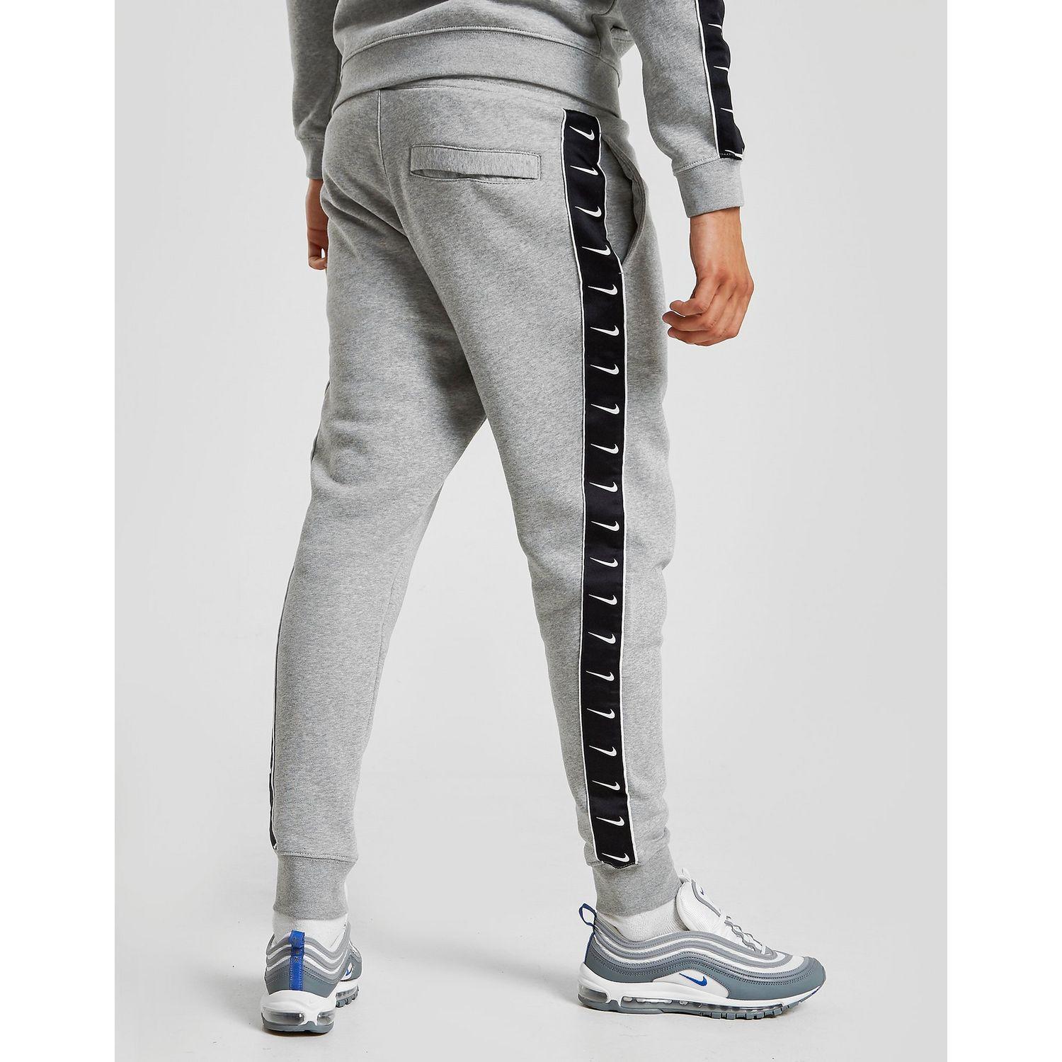 nike tracksuit with ticks down 