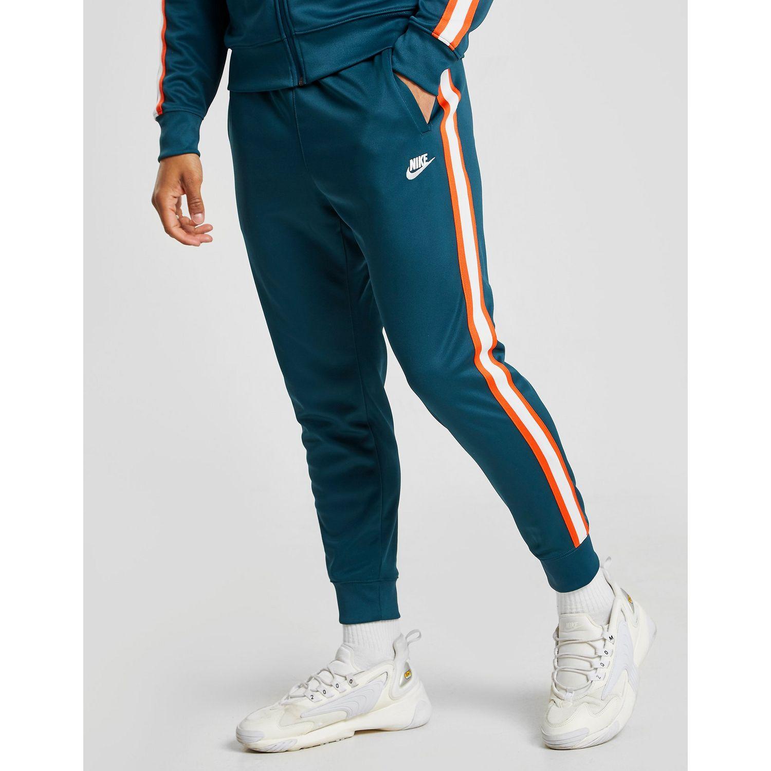 nike tribute track pants blue