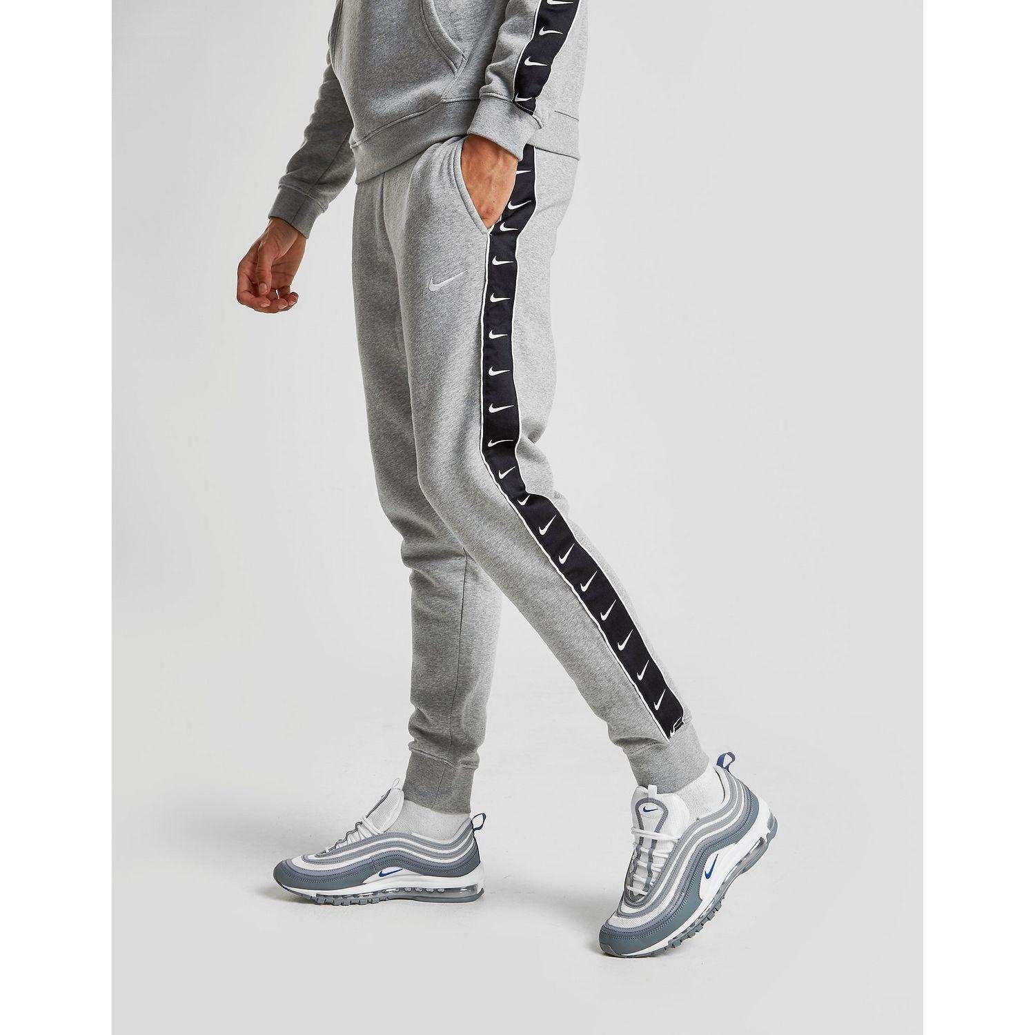 Shop Nike Tape Joggers Grey | UP TO 52% OFF