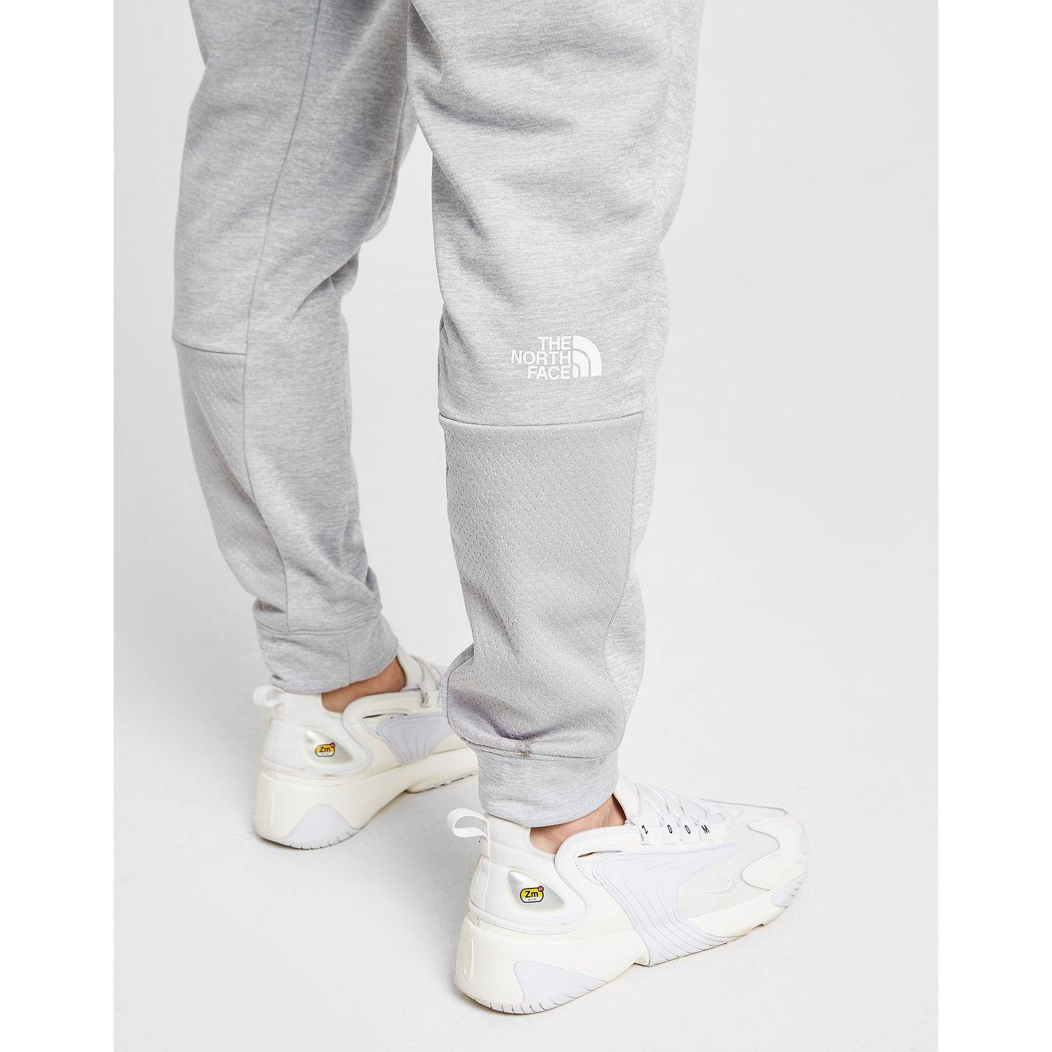 grey north face tracksuit bottoms