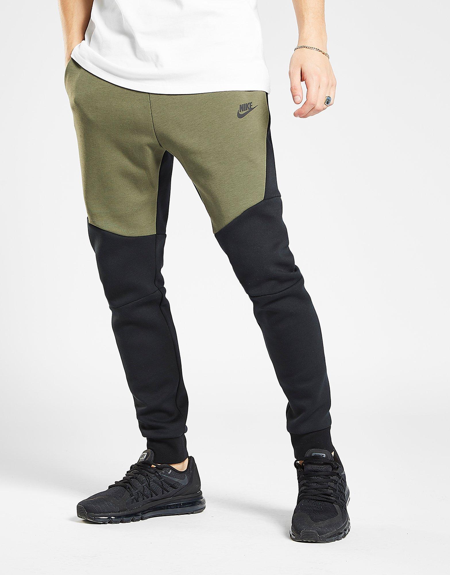 nike track pants green