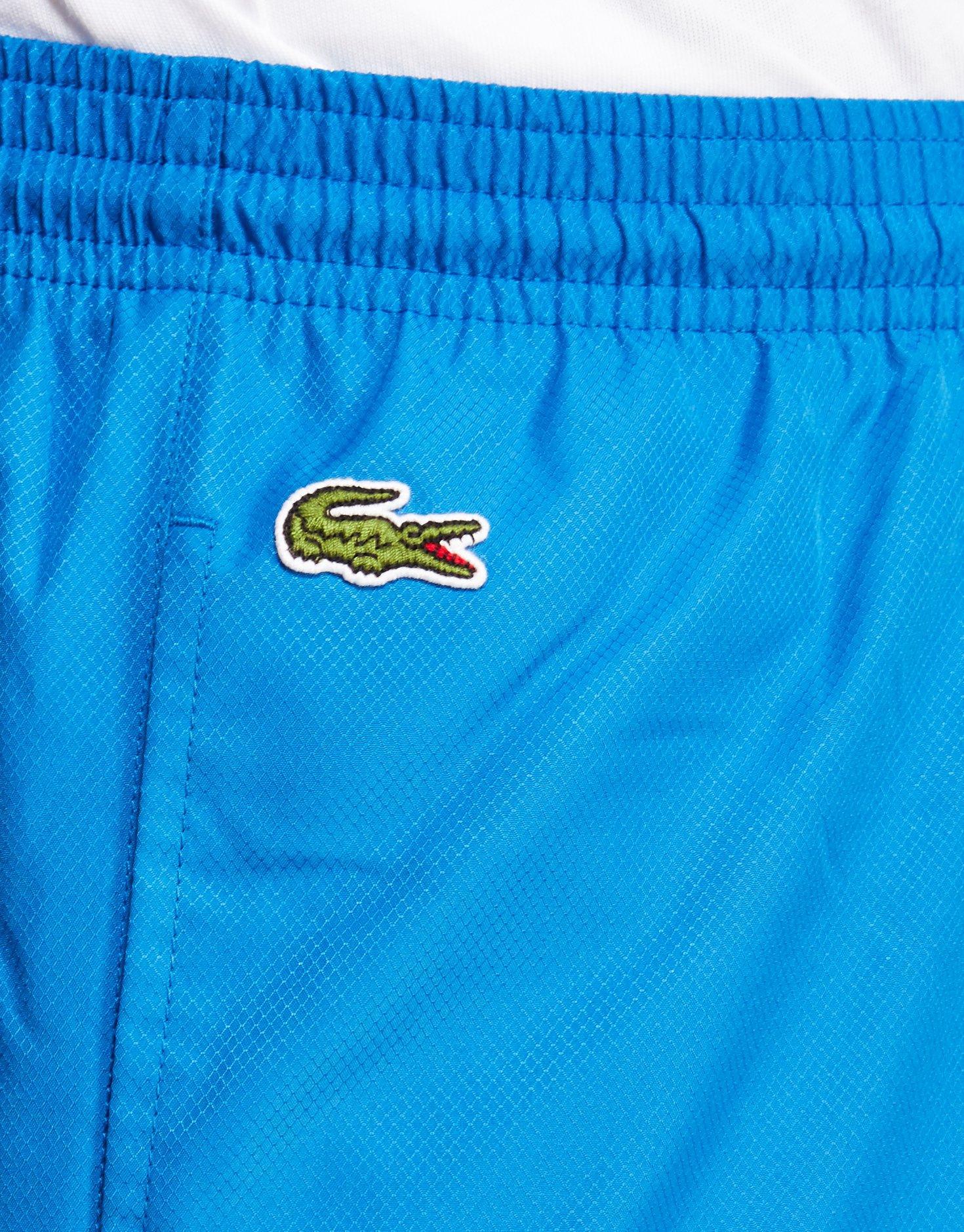 blue lacoste guppy pants