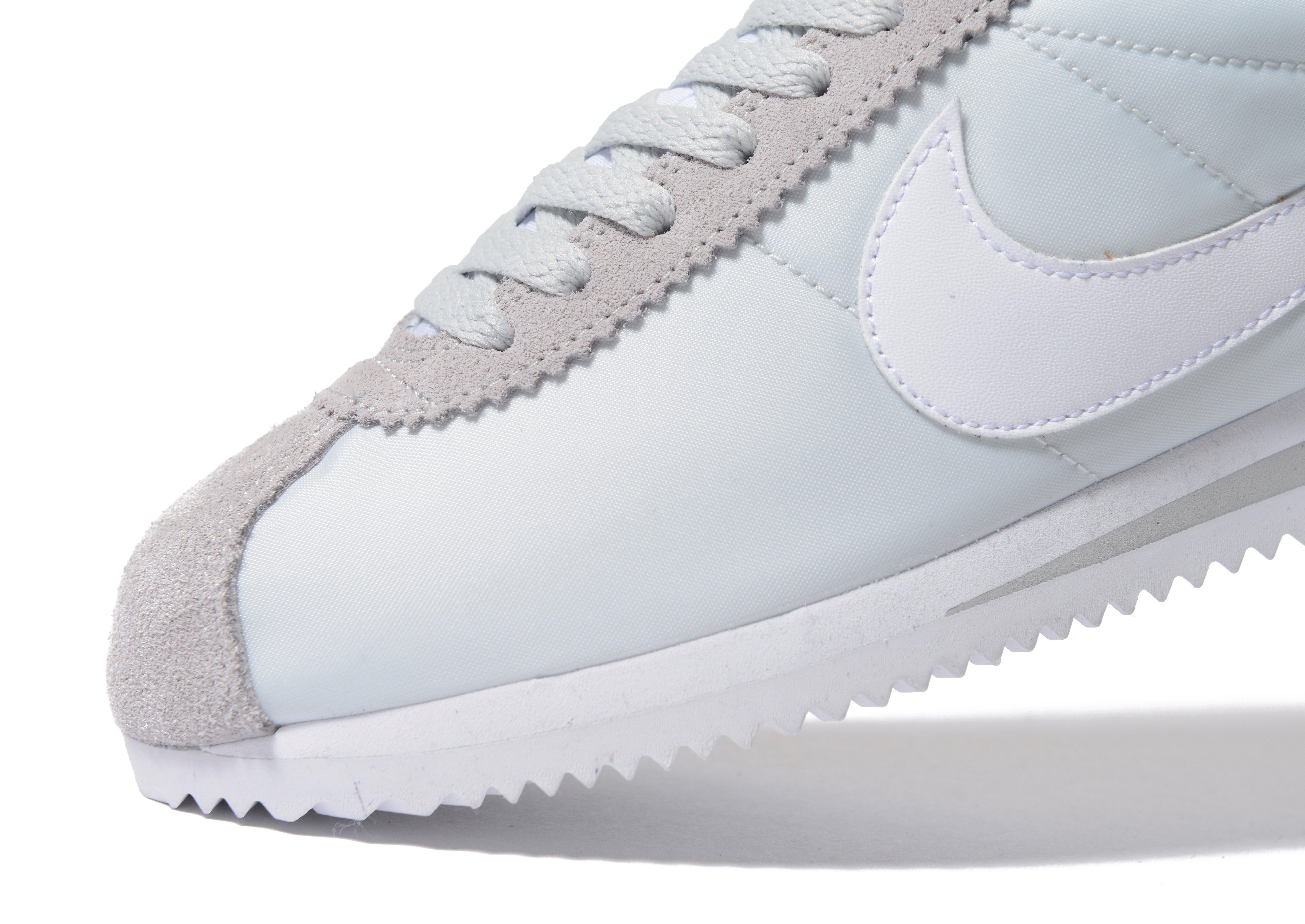nike cortez dirty white