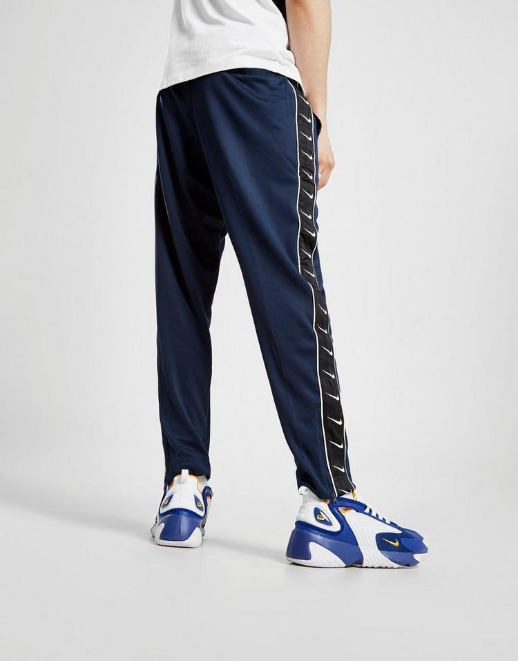 nike taped poly track pants