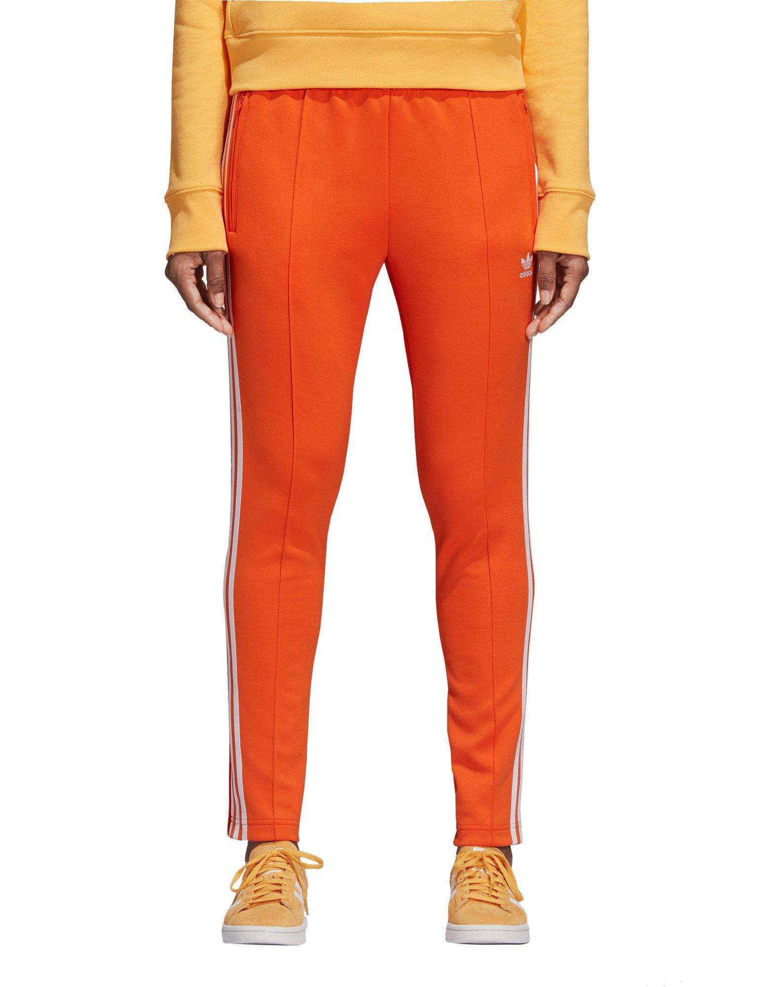 orange sst track pants
