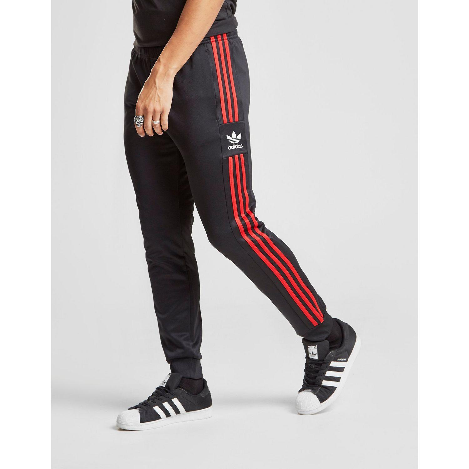 black and red adidas track pants