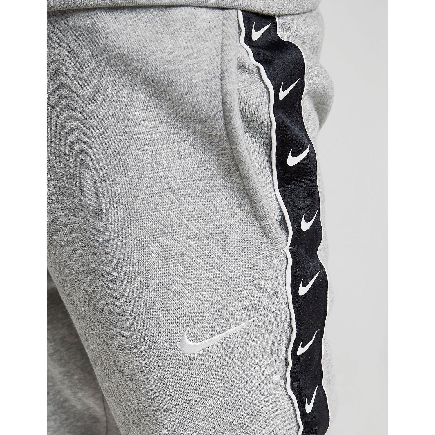 nike grey tape joggers