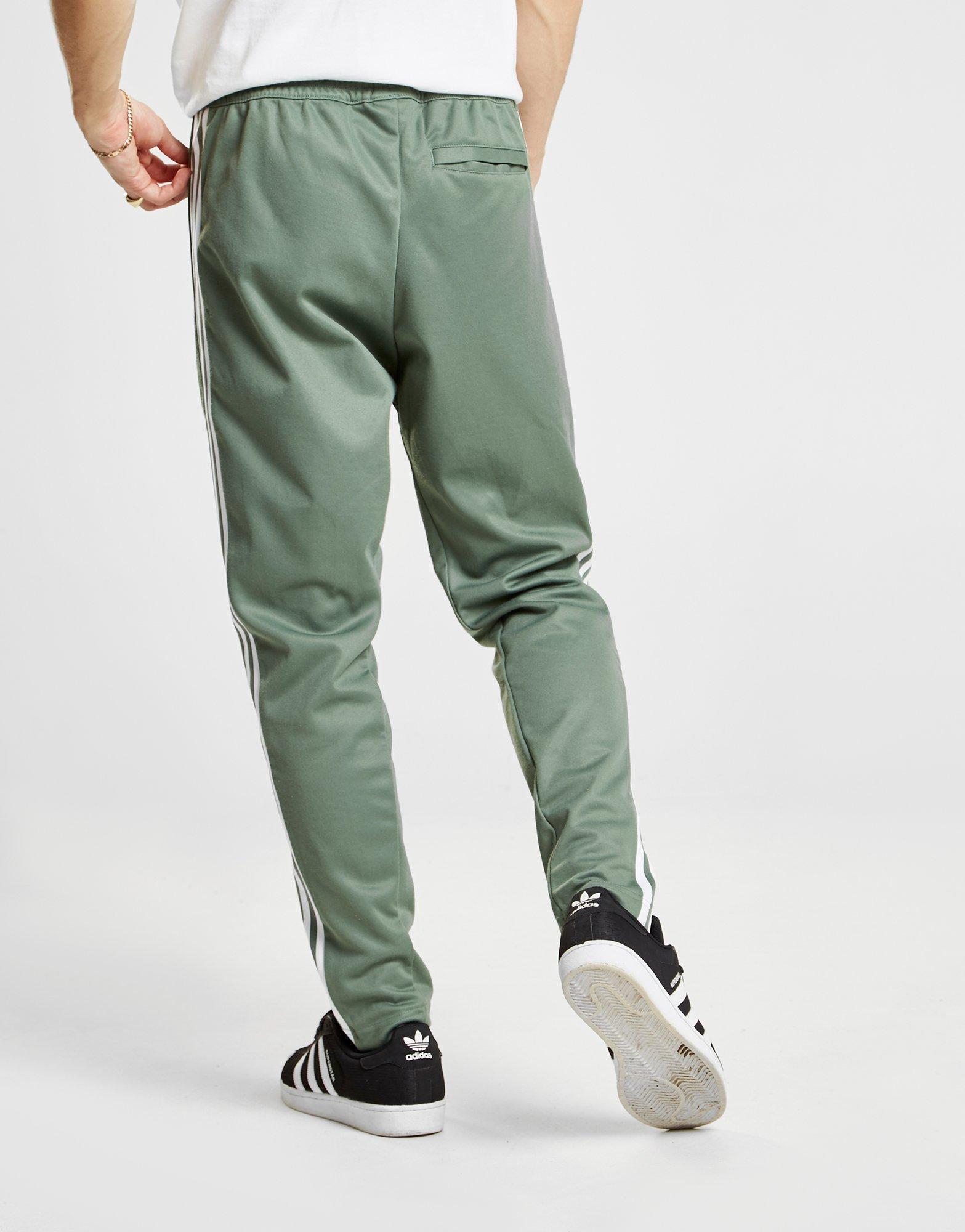 men's green track pants with red stripe