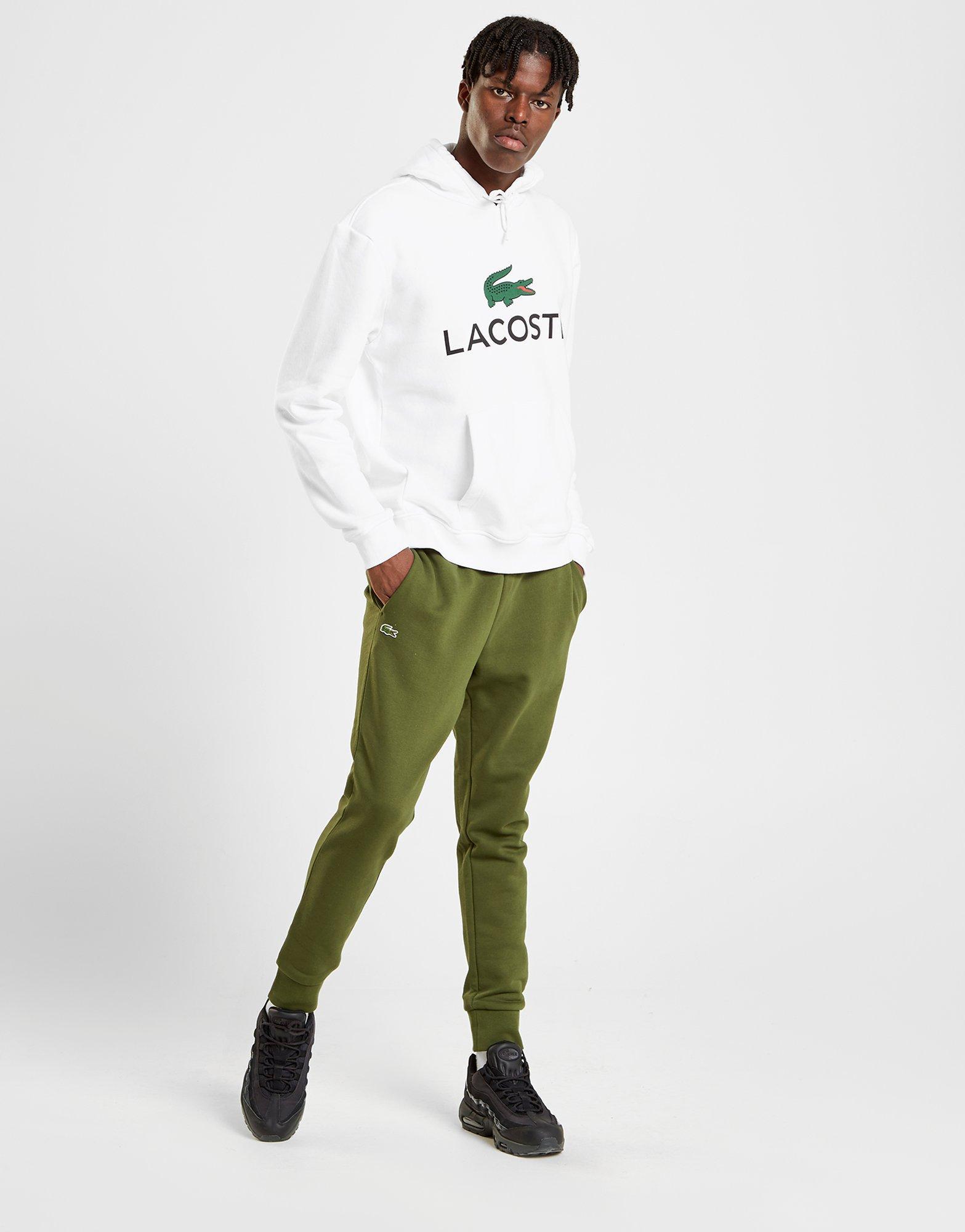 green lacoste guppy pants