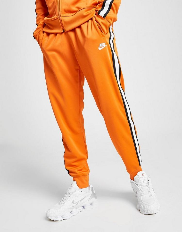 nike track pants yellow