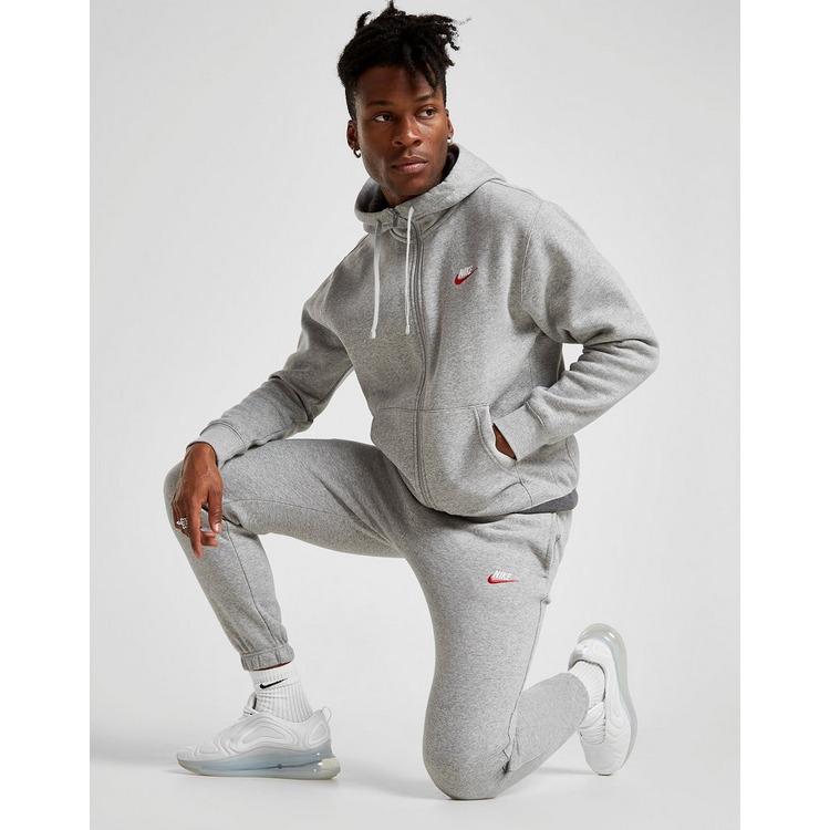 grey nike joggers with red tick